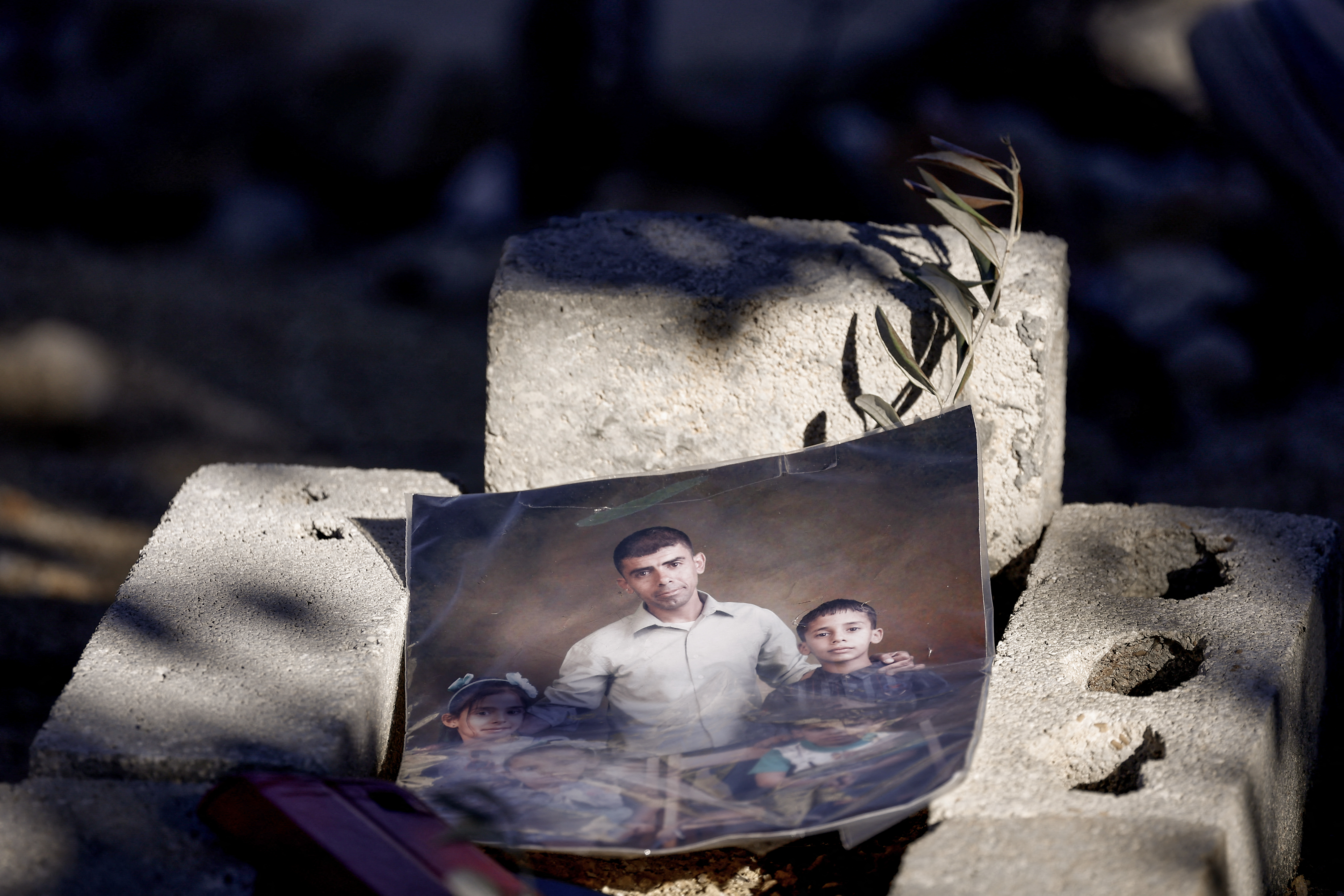 A photograph of Bilal Saleh sits a his grave in a cemetary in the village of As-Sawiyah, south of Nablus in the occupied West Bank.