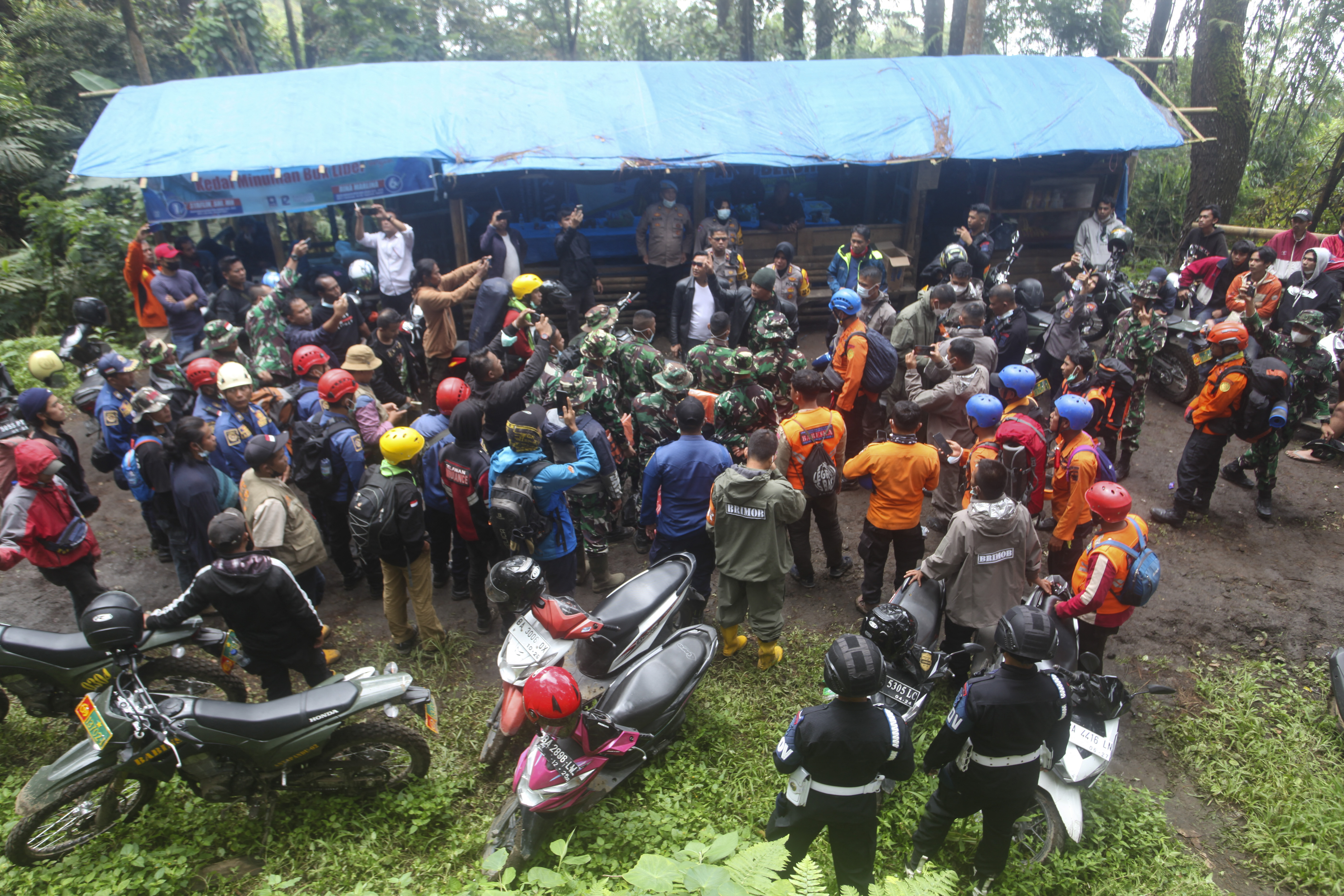 Rescuers prepare for a search and rescue operation after Mount Marapi erupted