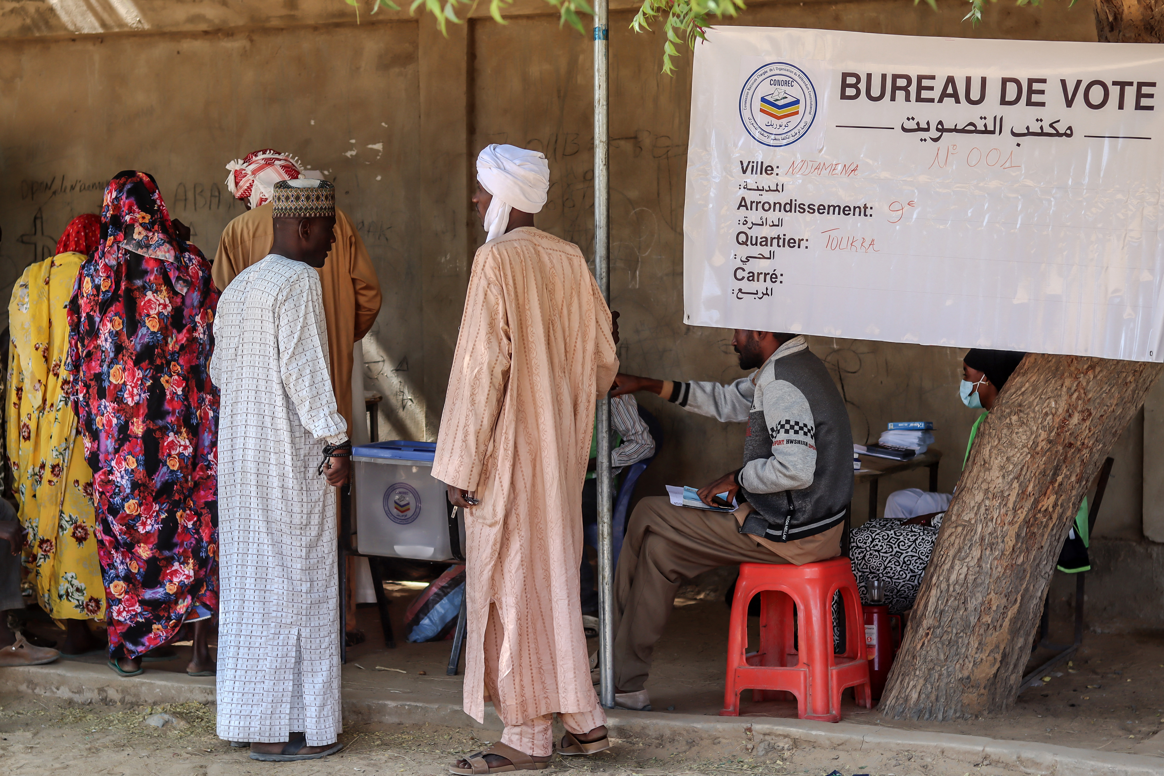 People at a polling station 