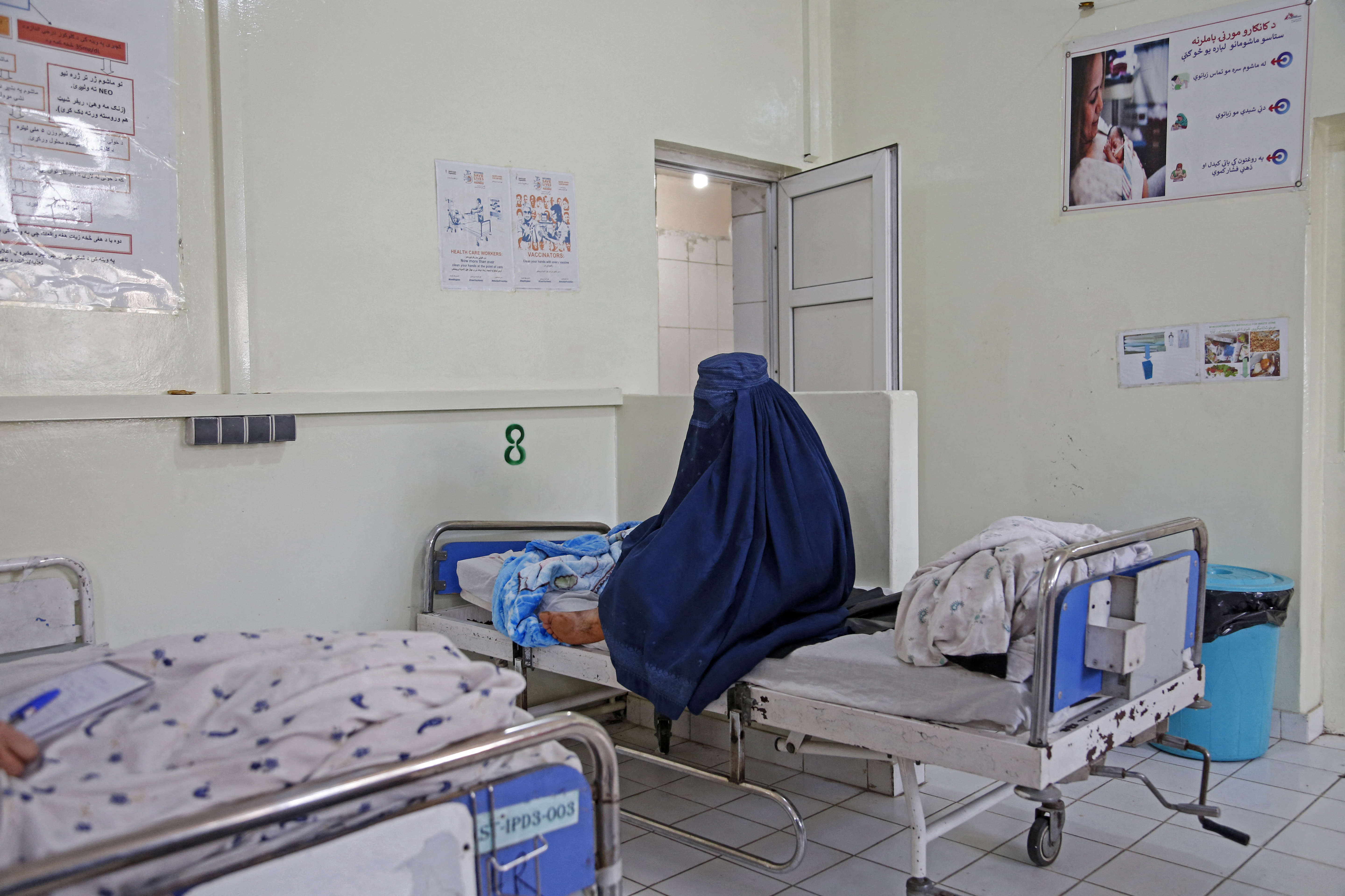 In this photograph taken on December 8, 2023, Afghan woman Basa holds her newborn child at the Doctors Without Borders (MSF)-run maternity hospital in Khost.