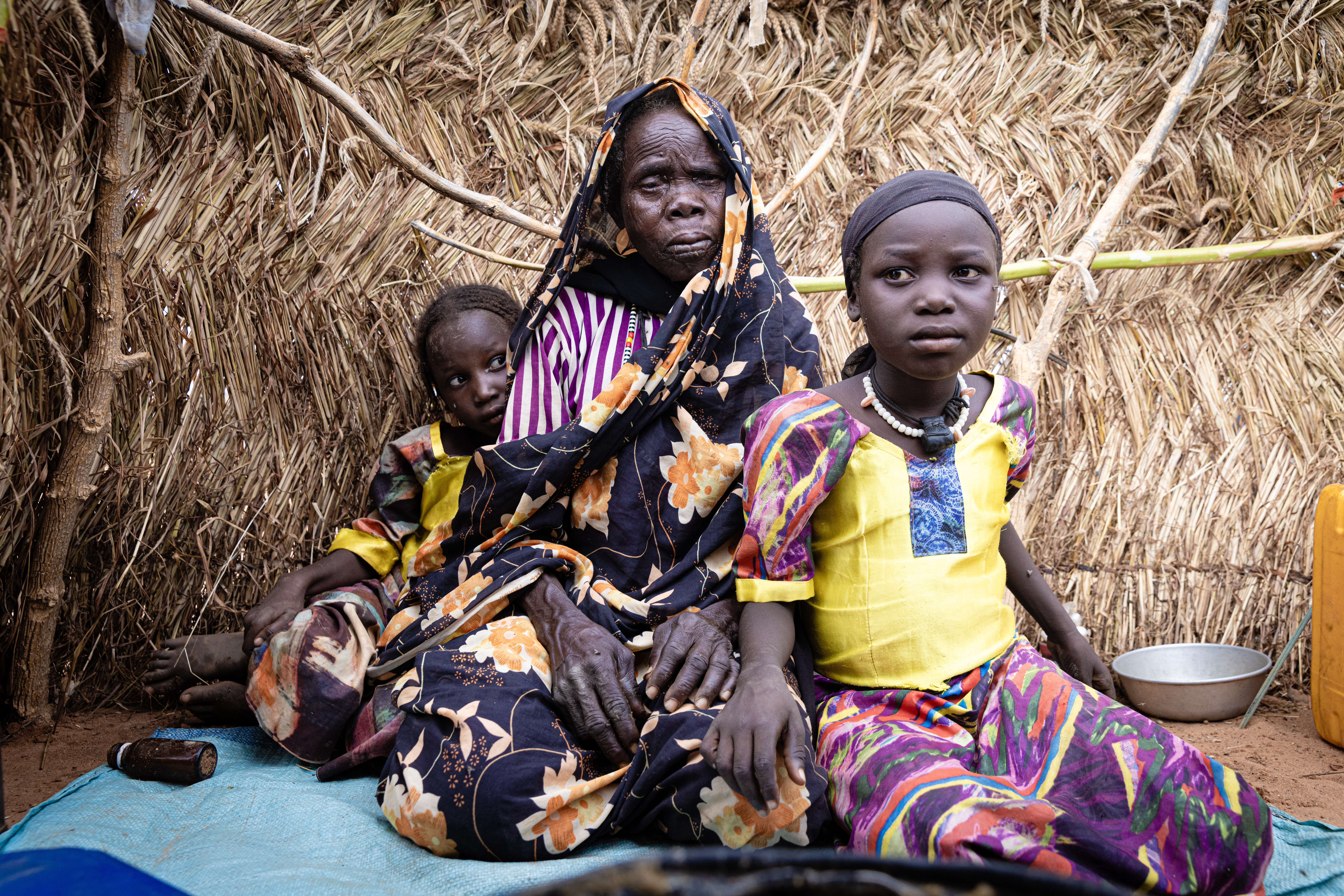 Kaltuma lives alone with her small granddaughters. The family survives on food given to them by neighbors and local people.