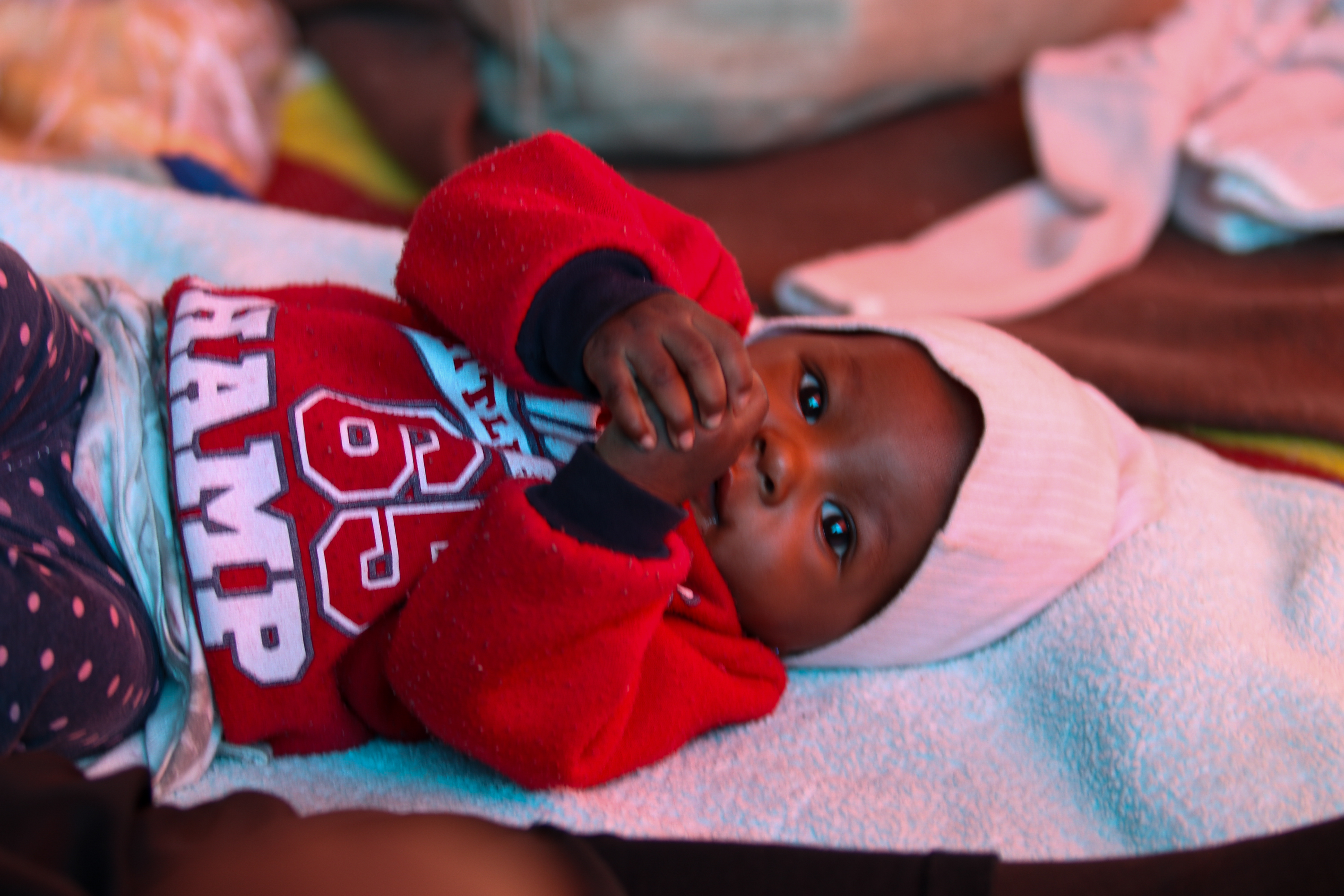 Baby in red sweatshirt