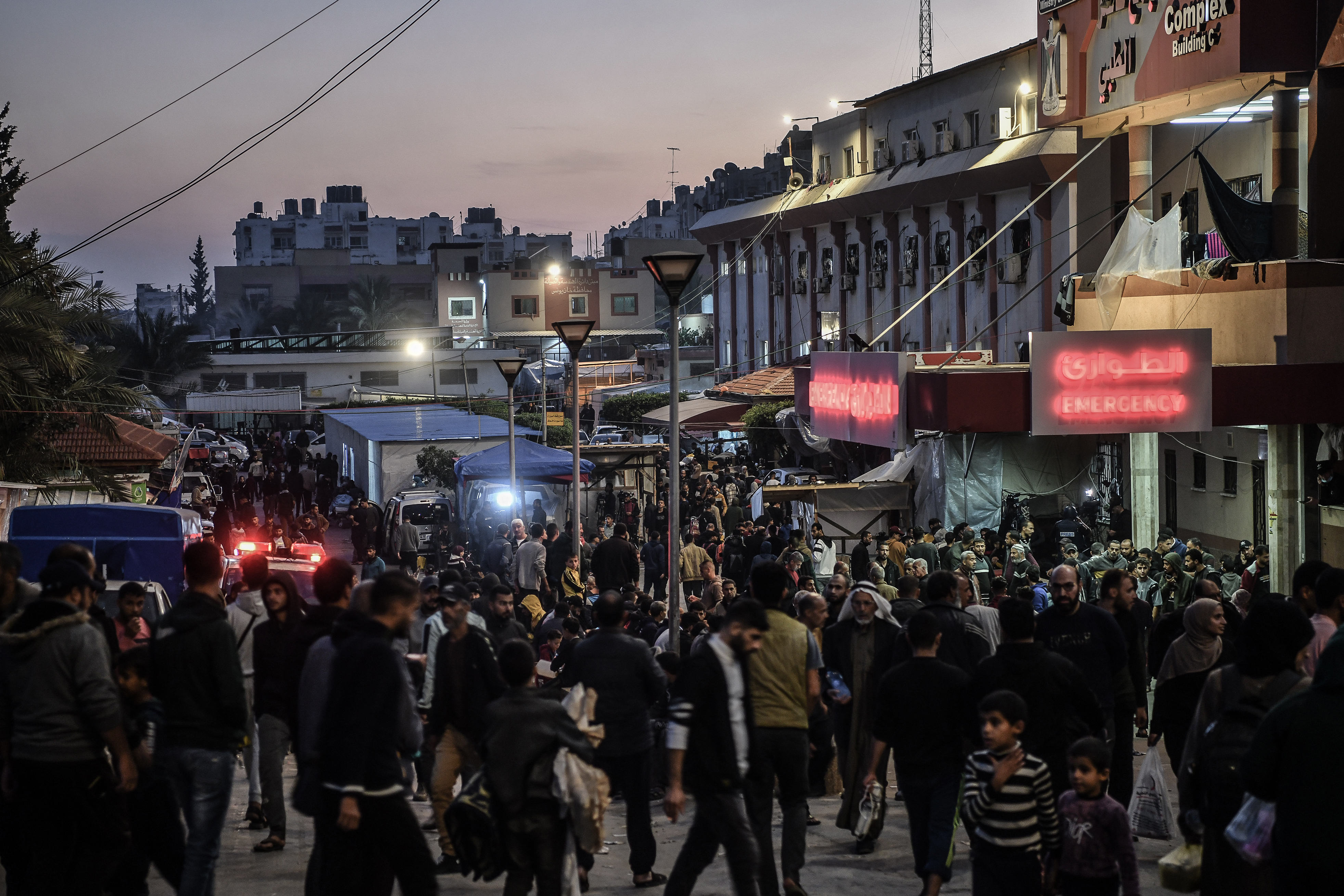 Palestinians walk on the streets as they set up tents around the Nasser Hospital to take shelter and continue their daily lives under difficult conditions due to Israeli attacks in Khan Yunis, Gaza.