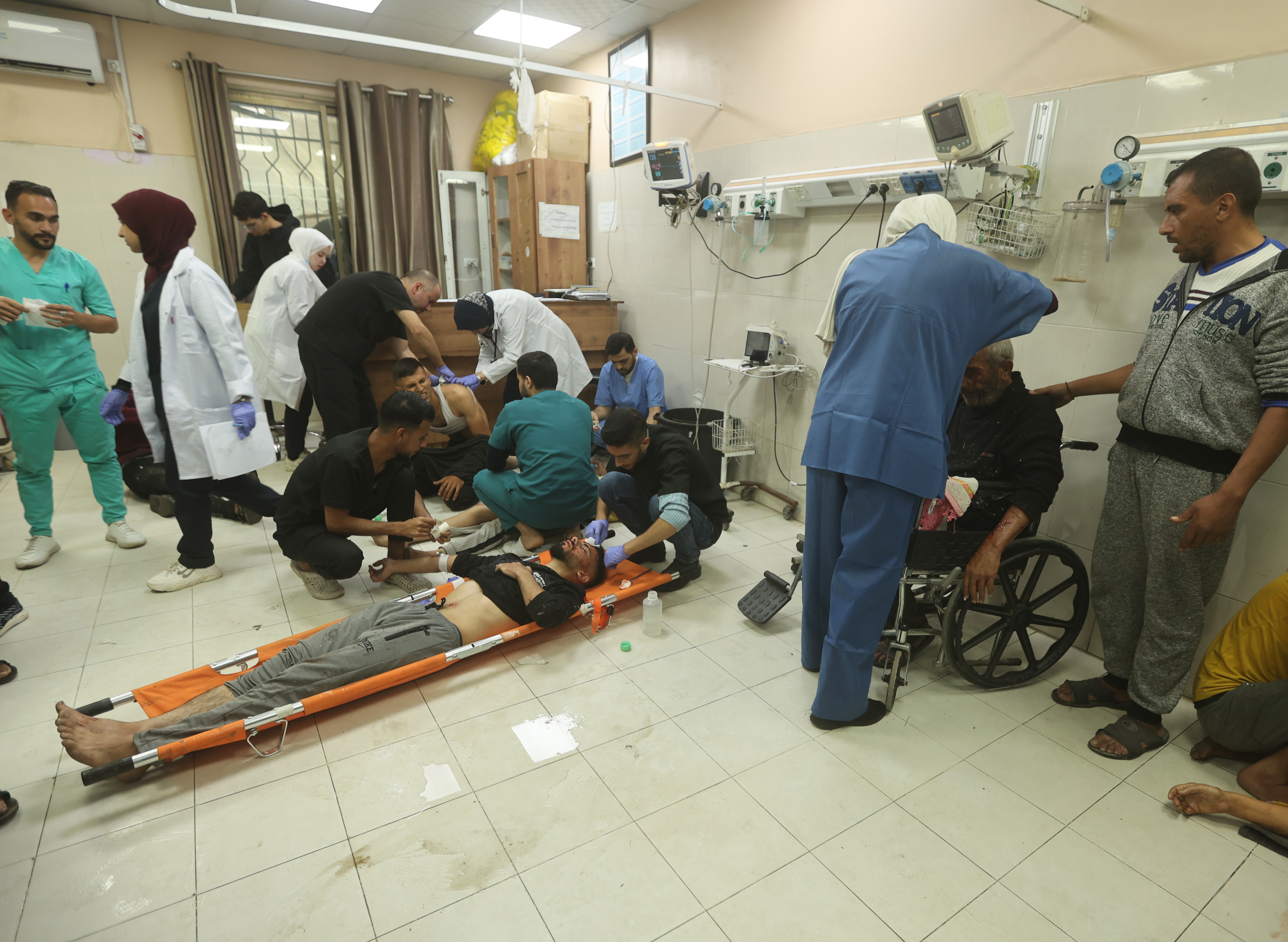 Injured Palestinians, including children, are brought to Nasser Hospital to receive medical treatment following Israeli attacks in Khan Yunis, Gaza.
