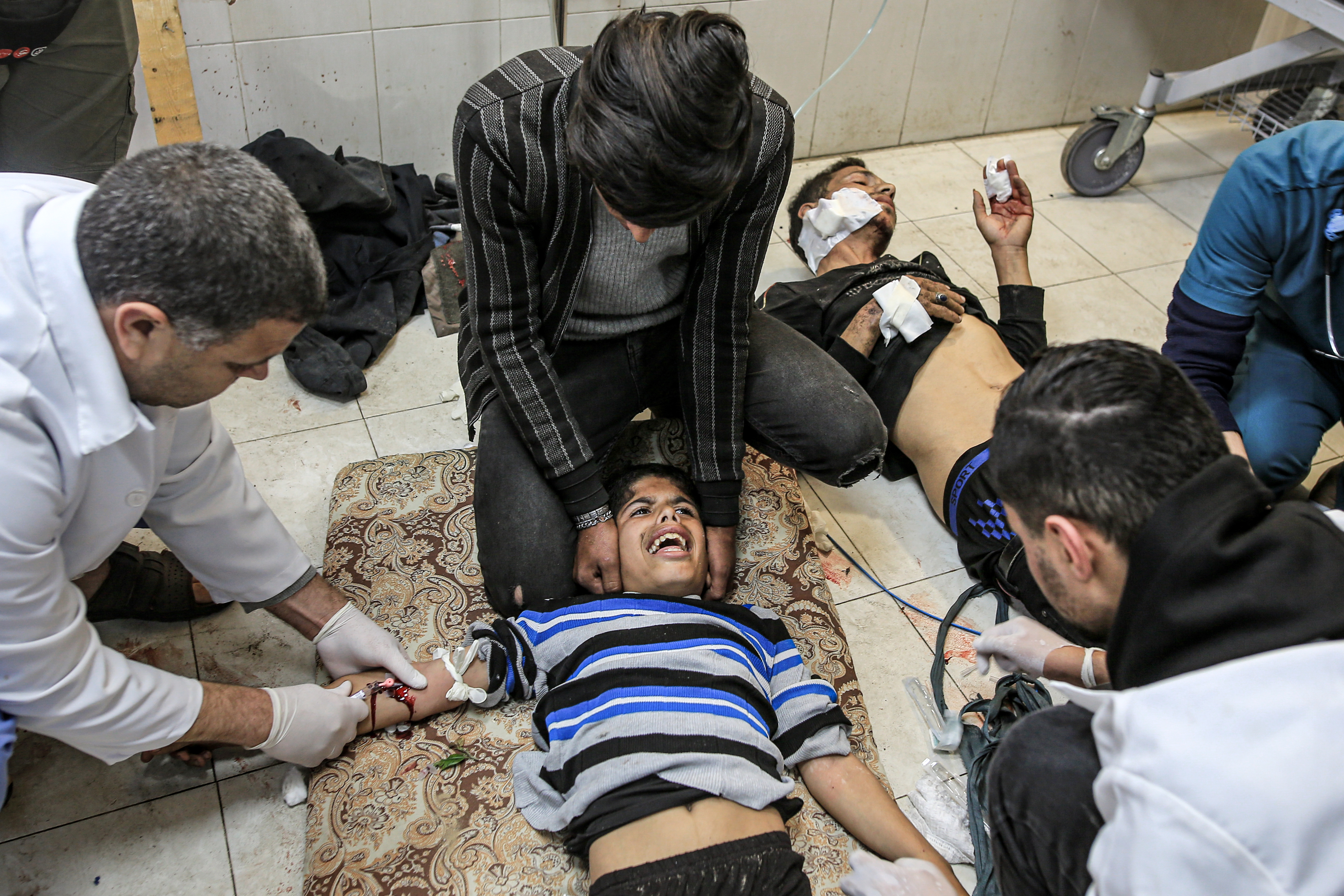 Injured Palestinians, including children, are brought to Nasser Hospital for medical treatment as Israeli attacks continue in Khan Yunis, Gaza.