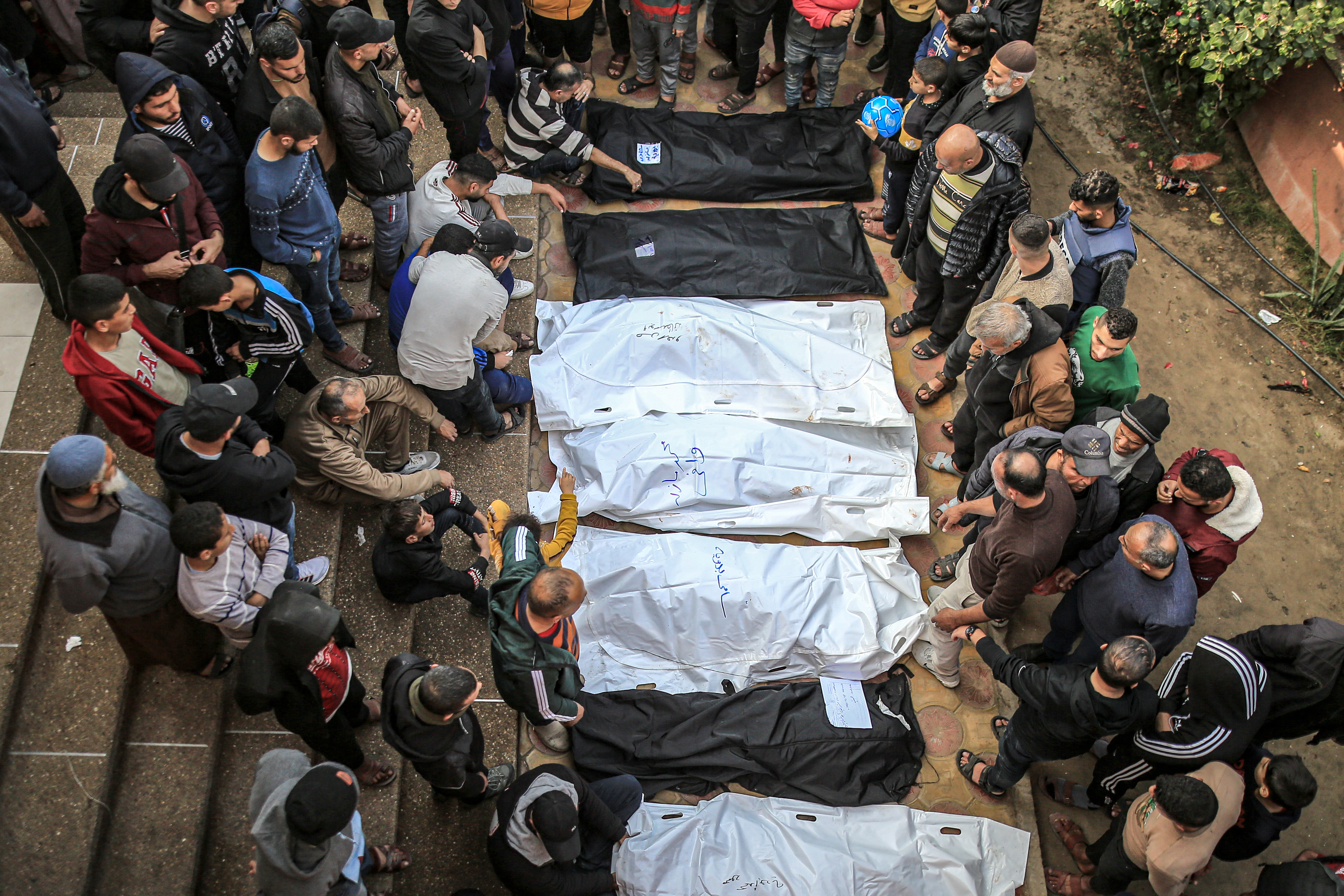 Bodies of deceased Palestinians, including children, are brought to Nasser Hospital as Israeli attacks continue in Khan Yunis, Gaza.