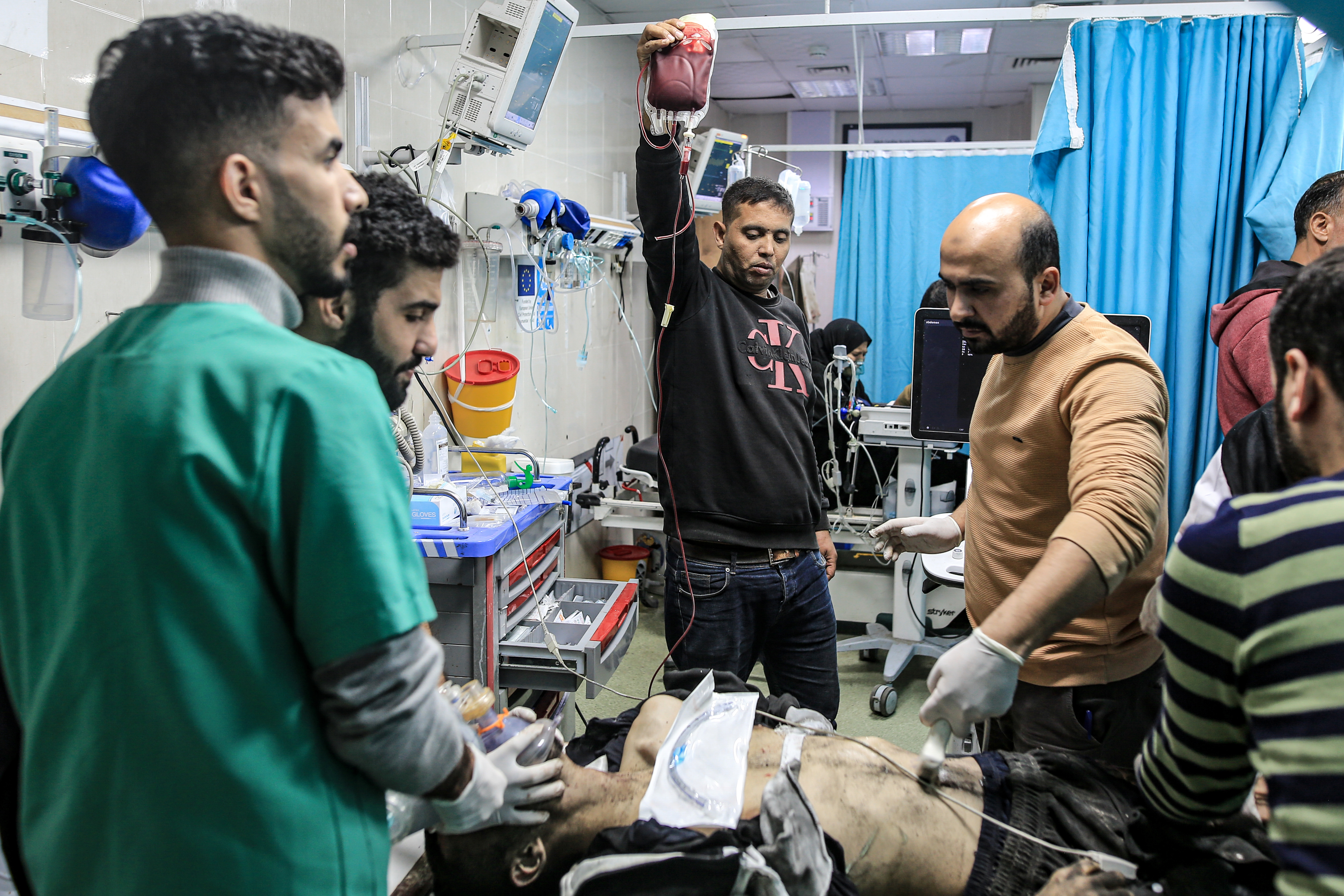 Injured Palestinians, including children, are brought to Nasser Hospital for medical treatment as Israeli attacks continue in Khan Yunis, Gaza.