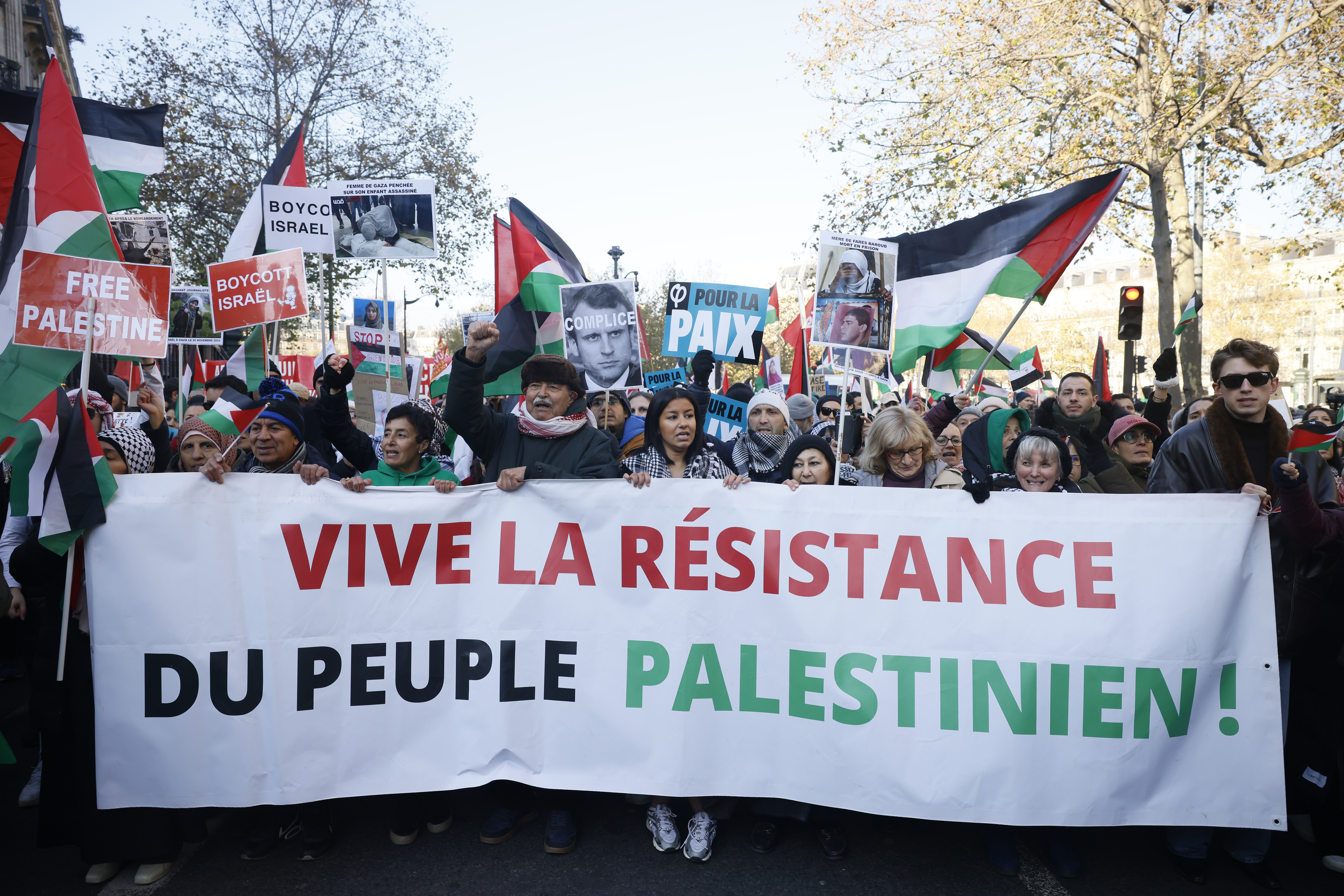 People chant slogans holding banners that reads « Long live the resistance of the Palestinian people" during a pro-Palestinian rally, in Paris, Saturday, Dec. 2