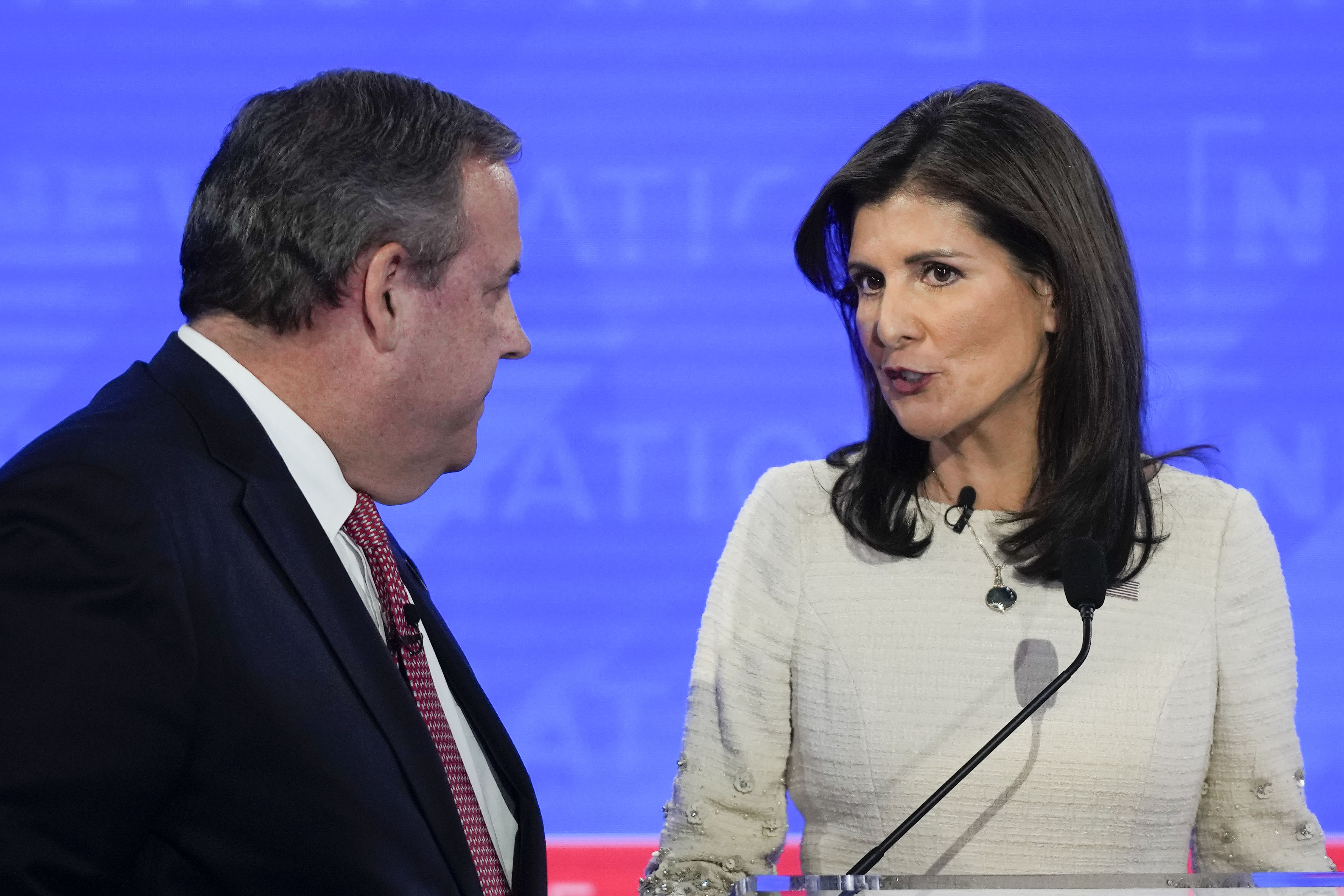 Chris Christie stands next to Nikki Haley on the debate stage in Tuscaloosa