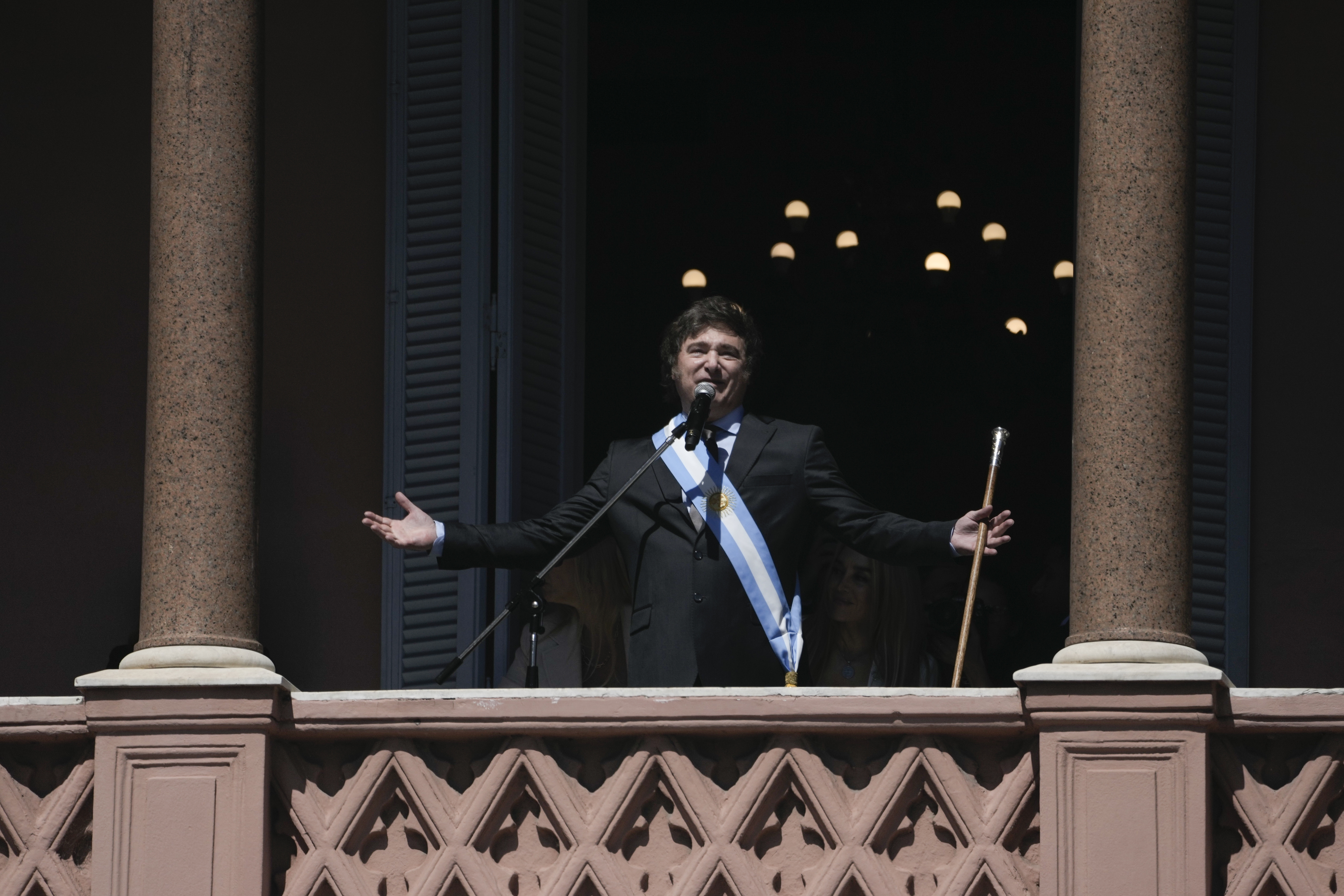 Argentina's newly sworn-in President Javier Milei addresses supporters from the balcony of the government house in Buenos Aires, Argentina, Sunday, Dec. 10, 2023. [AP Photo/Rodrigo Abd]