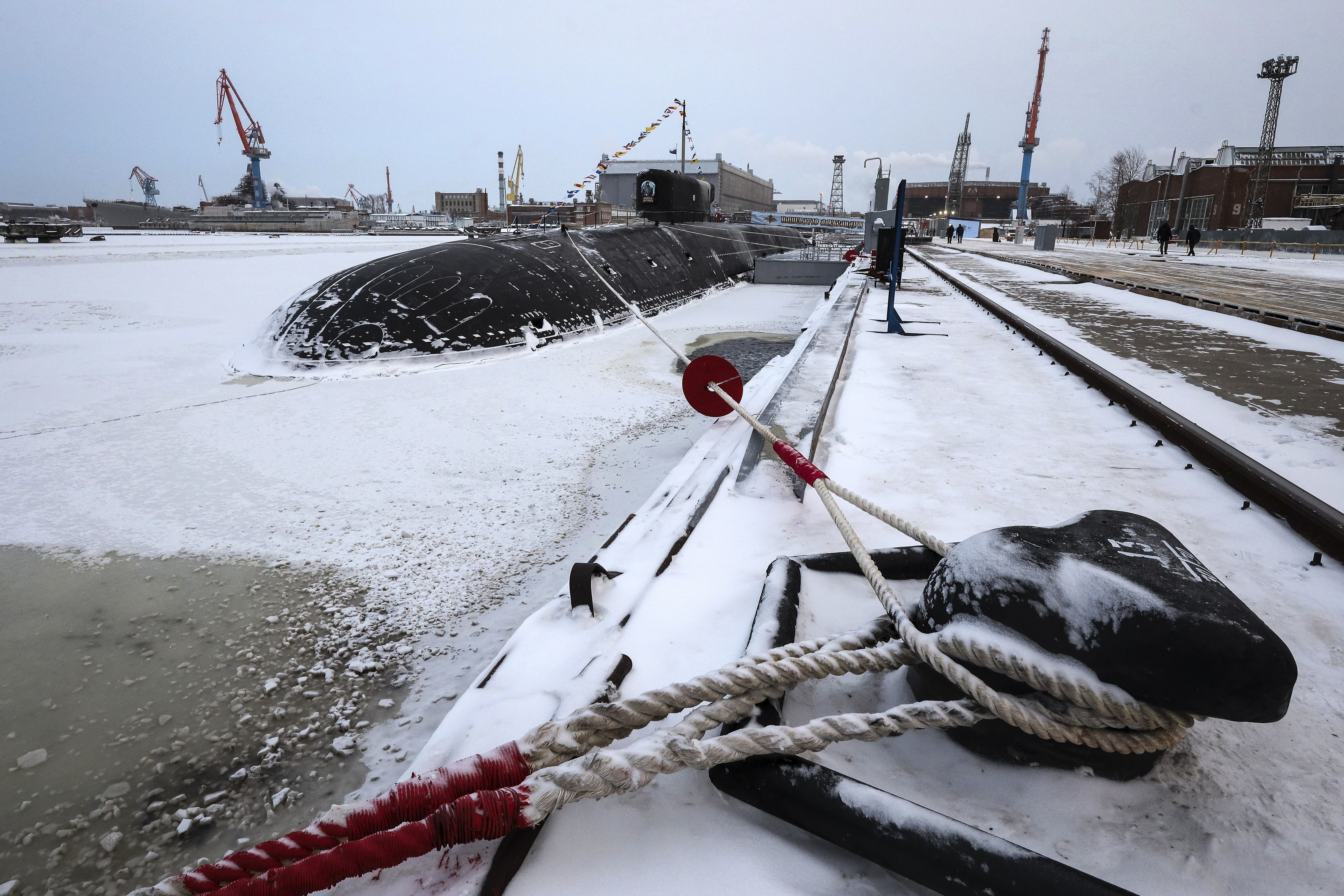 A wide view of the Emperor Alexander III. It is black and surrounded by snow and ice