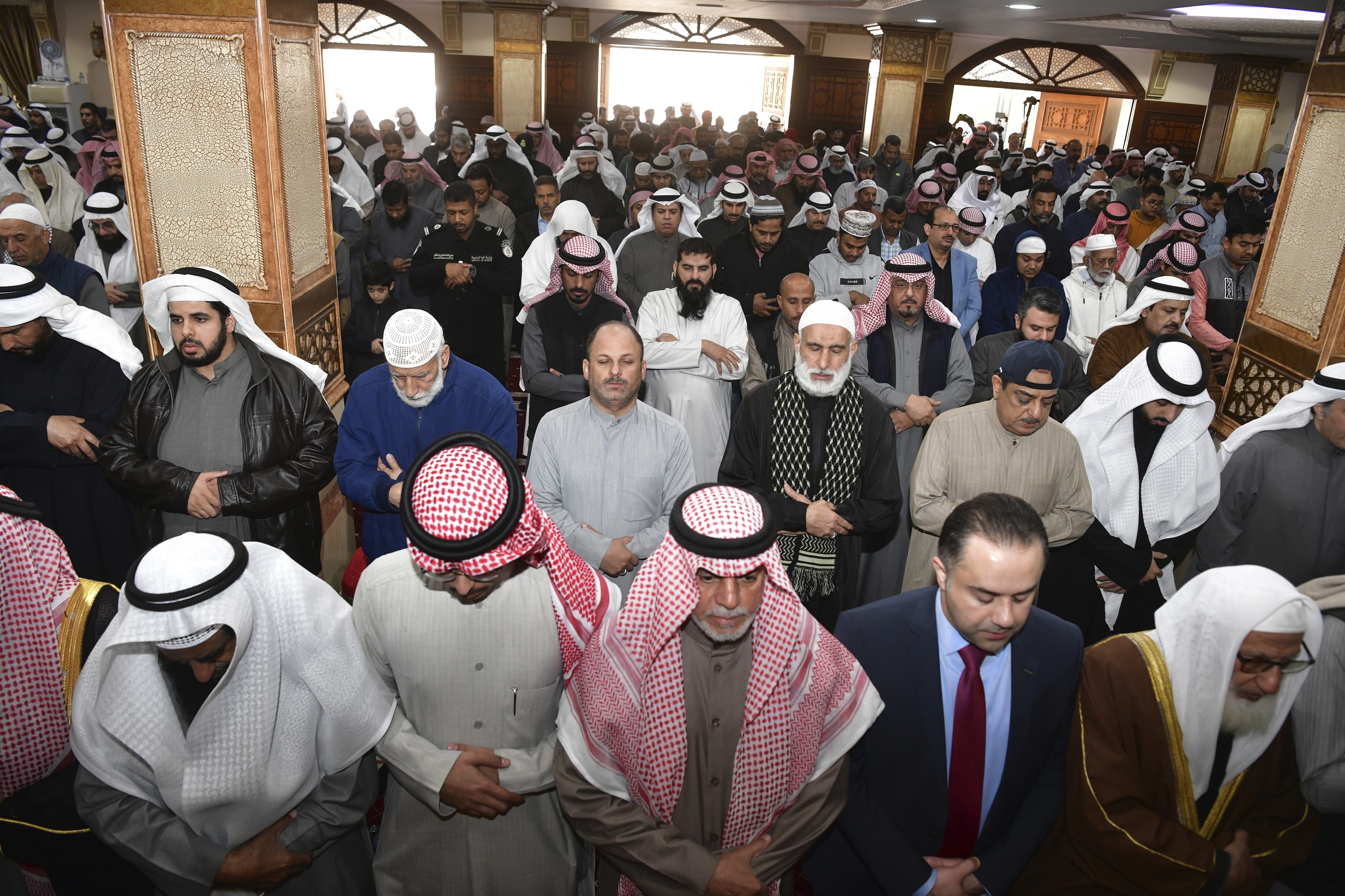 People pray during the funeral ceremony of the Emir of Kuwait Sheikh Nawaf Al Ahmad Al Sabah at the Bilal bin Rabah Mosque in Al-Siddiq district of Kuwait, Sunday [Jaber Abdulkhaleg/AP Photo]