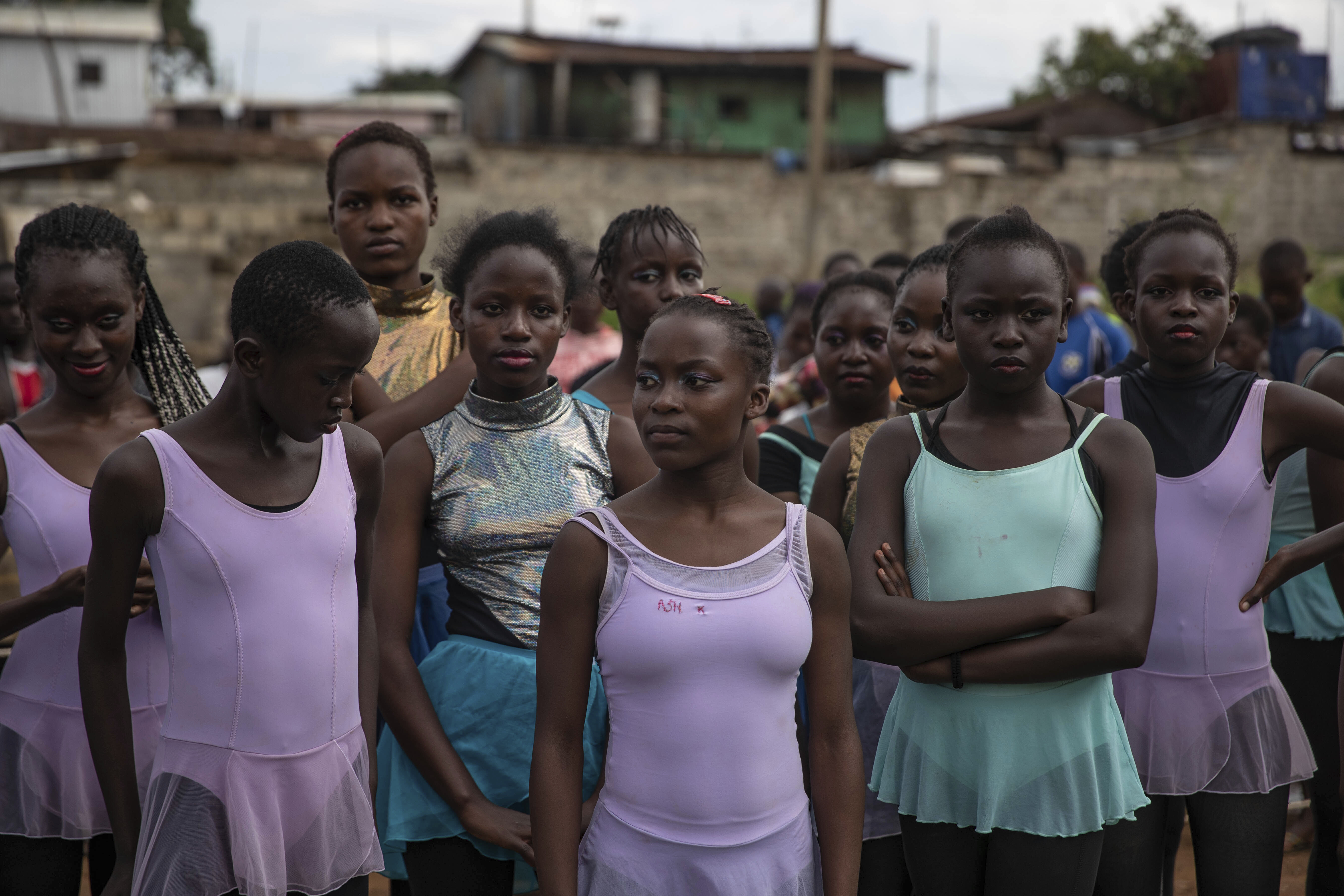 Young dancers practice by the Kenya - Uganda railway line