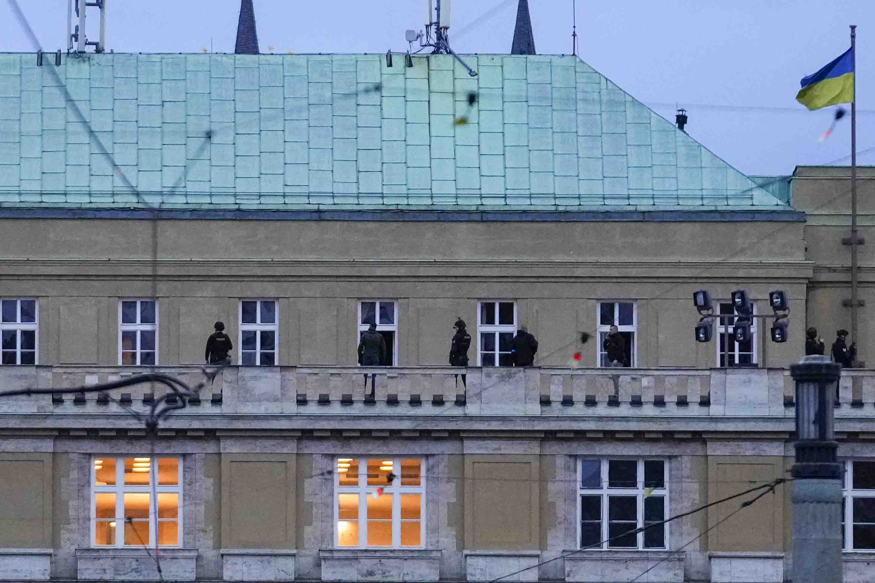 Police on the balcony of the Philosophy Building which was targeted in the shooting 