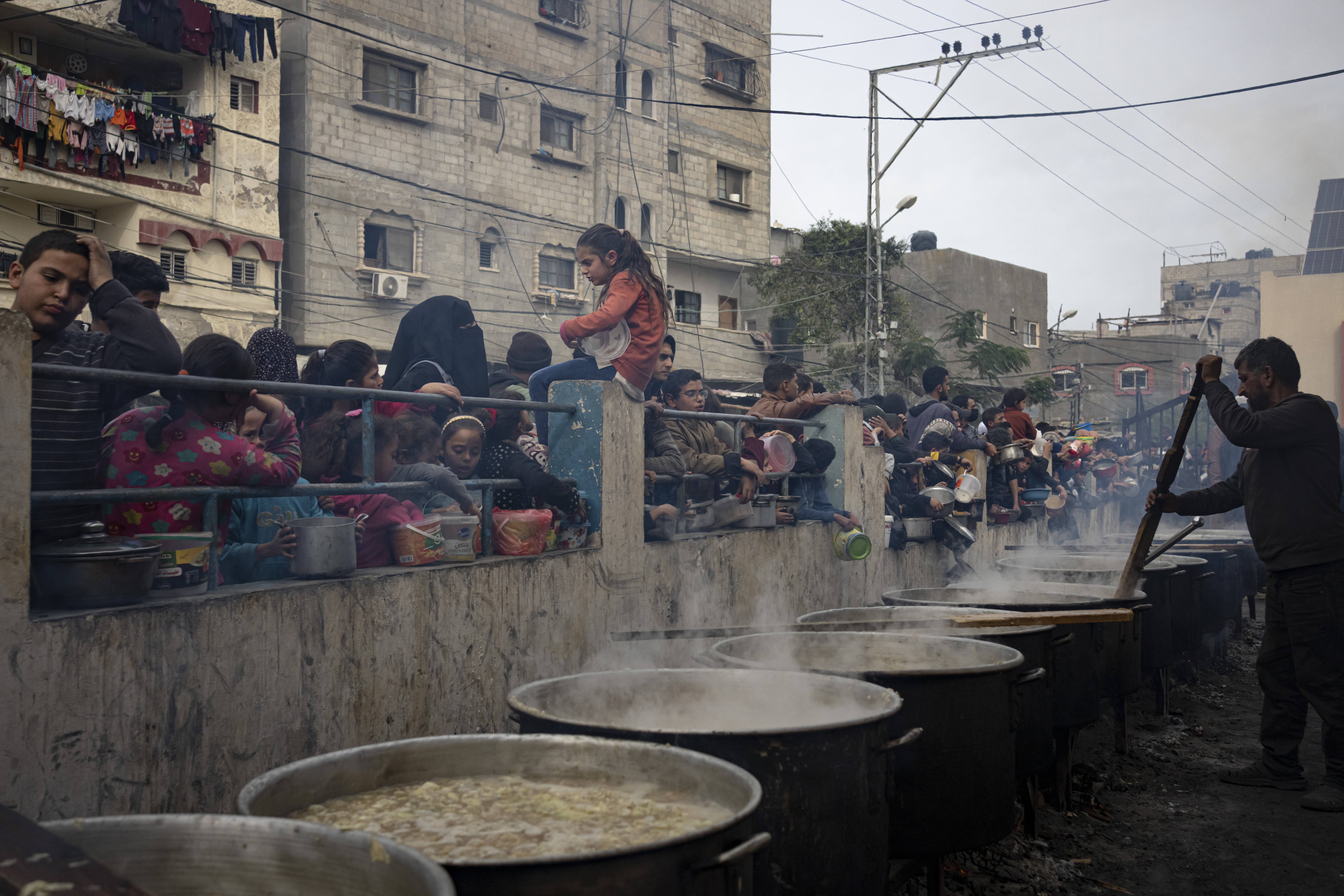 Palestinians line up for a free meal in Rafah, Gaza Strip.