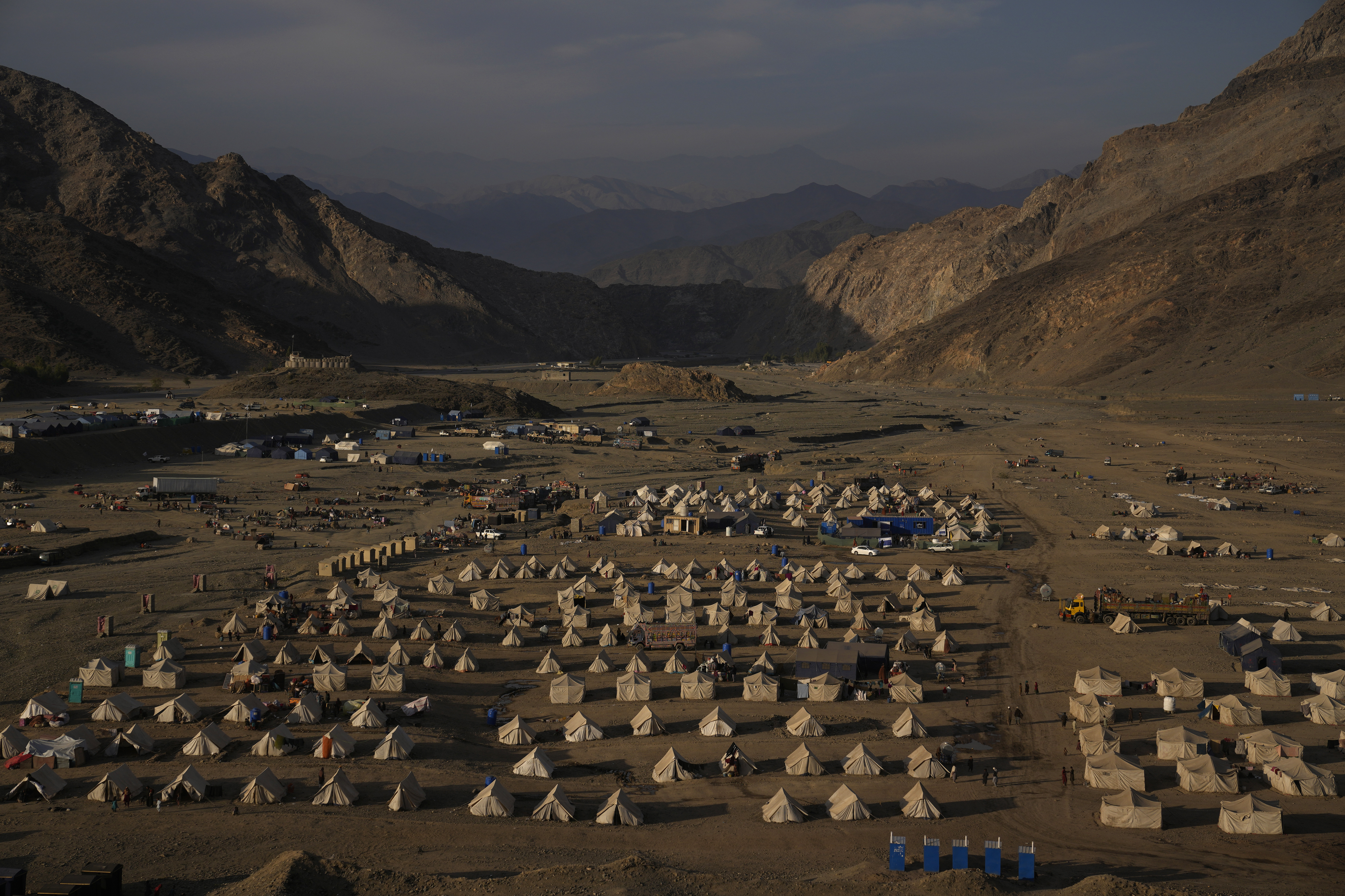 Tents stand in a migrant camp at the Pakistan-Afghanistan border in Torkham, Afghanistan, Friday, Nov. 17