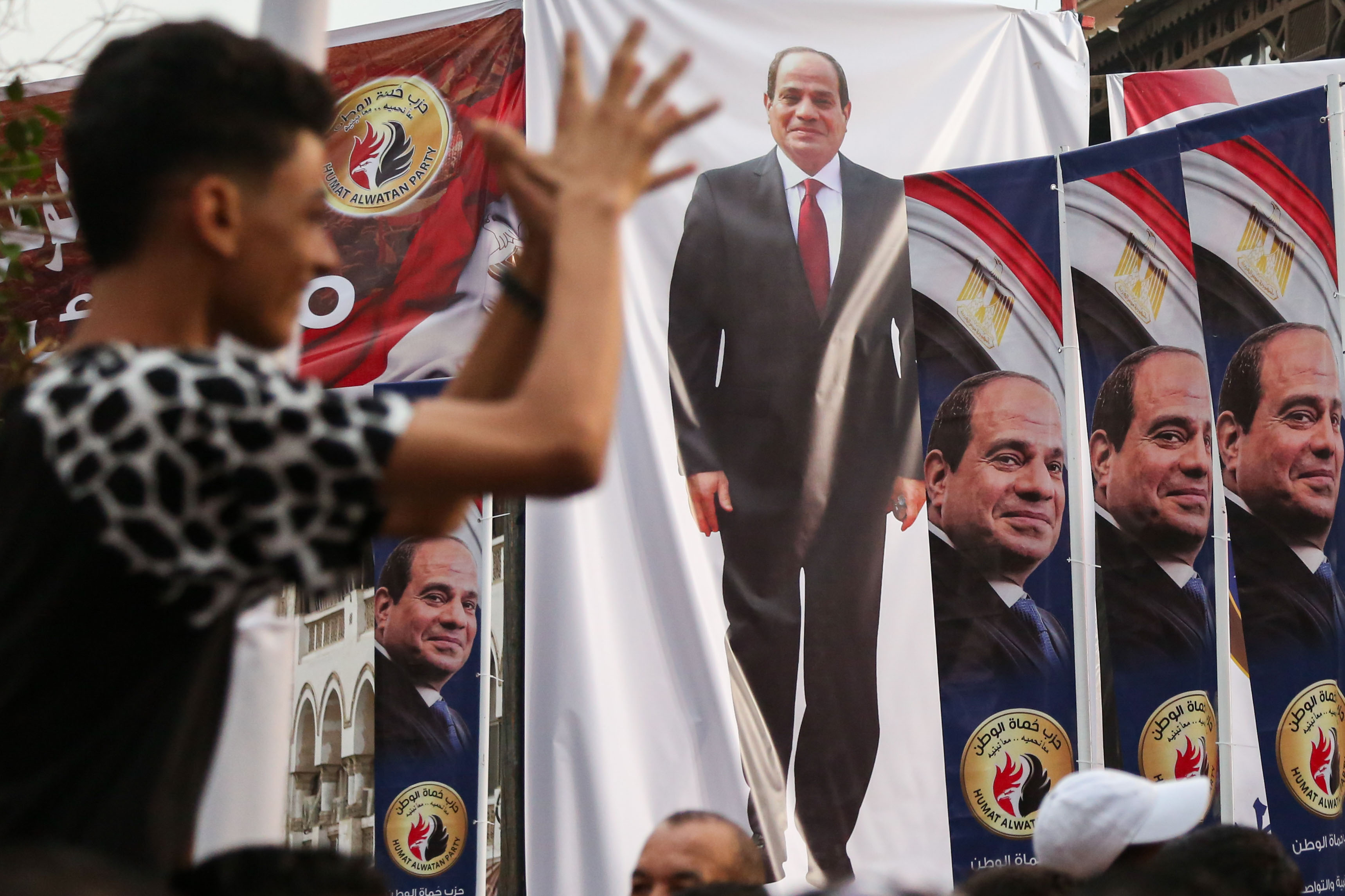 Banners of the Egyptian President Abdel Fattah el-Sisi hang in El Korba Square in the Heliopolis neighbourhood of Cairo during a supporters' rally as they wait for his candidacy announcement in the presidential elections on October 2, 2023 [Islam Safwat/Getty Images]