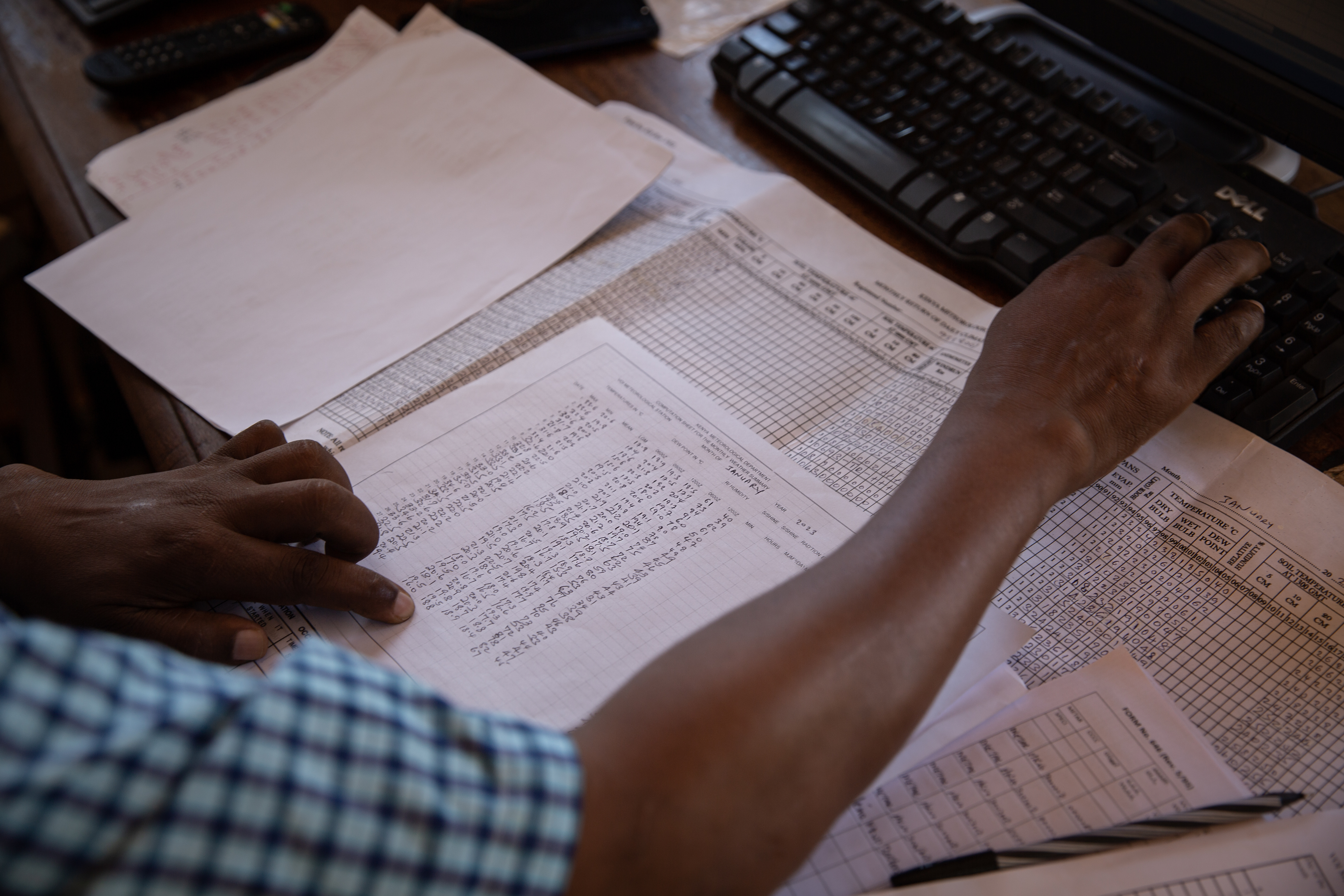 Christopher Mungai, a meteorological technician at the Kenya Meteorological Department in Taita Taveta plots weather data into a digital global system by the World Meteorological Organization. The office has its own weather station and observations must be uploaded to the system immediately after being registered. This is done every hour across the 47 local stations in Kenya.