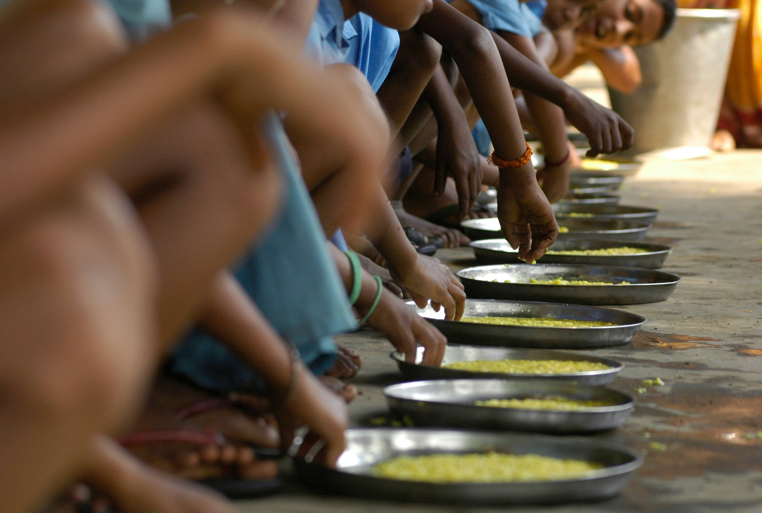 Children eat food at an "anganwadi" (creche) centre under the Integrated Child Development Services (ICDS) scheme in Gandhi village, about 45 km (28 miles) west of the northeastern Indian city of Agartala