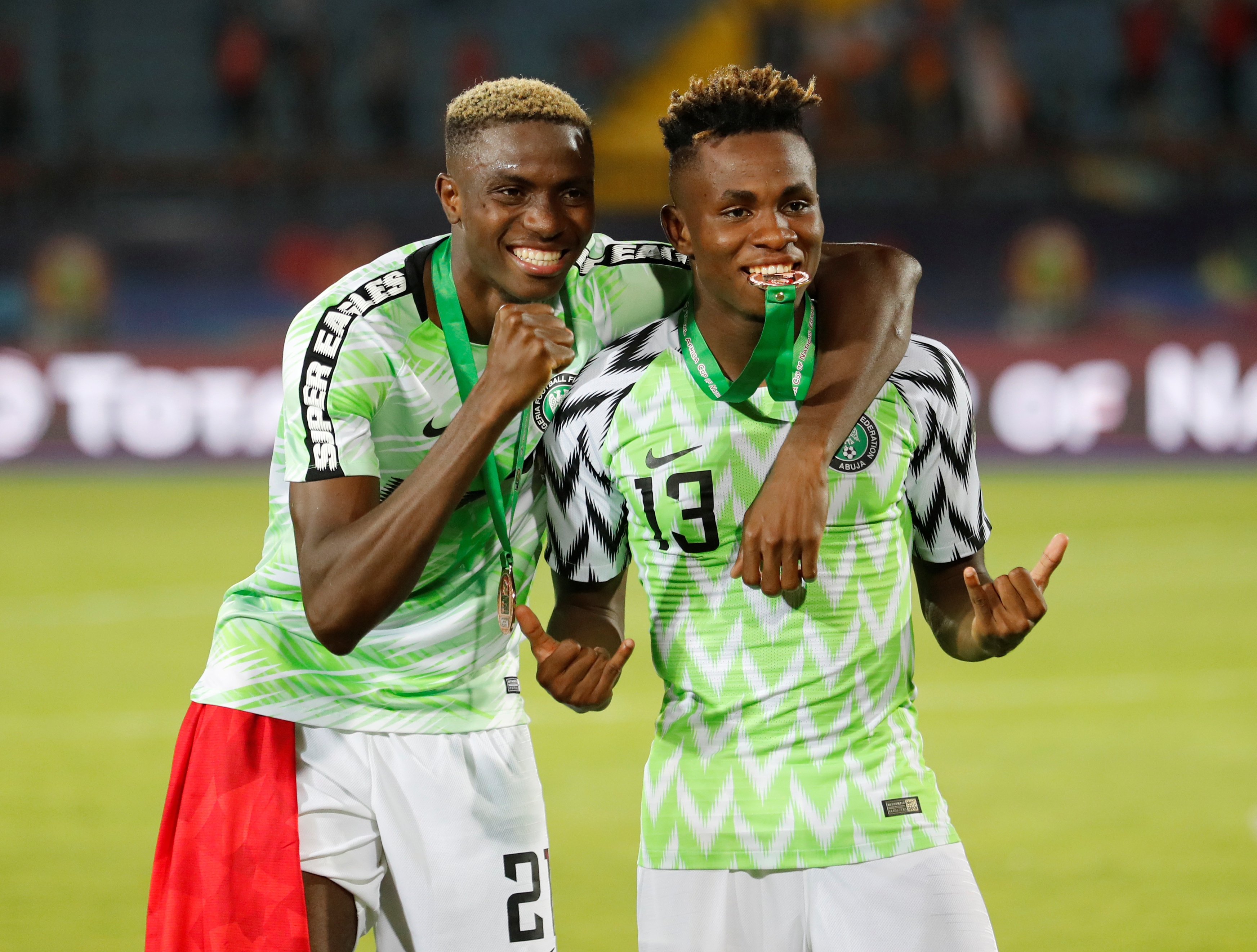 Nigeria's Victor Osimhen and Samuel Chukwueze celebrate after winning the Third Place Play Off