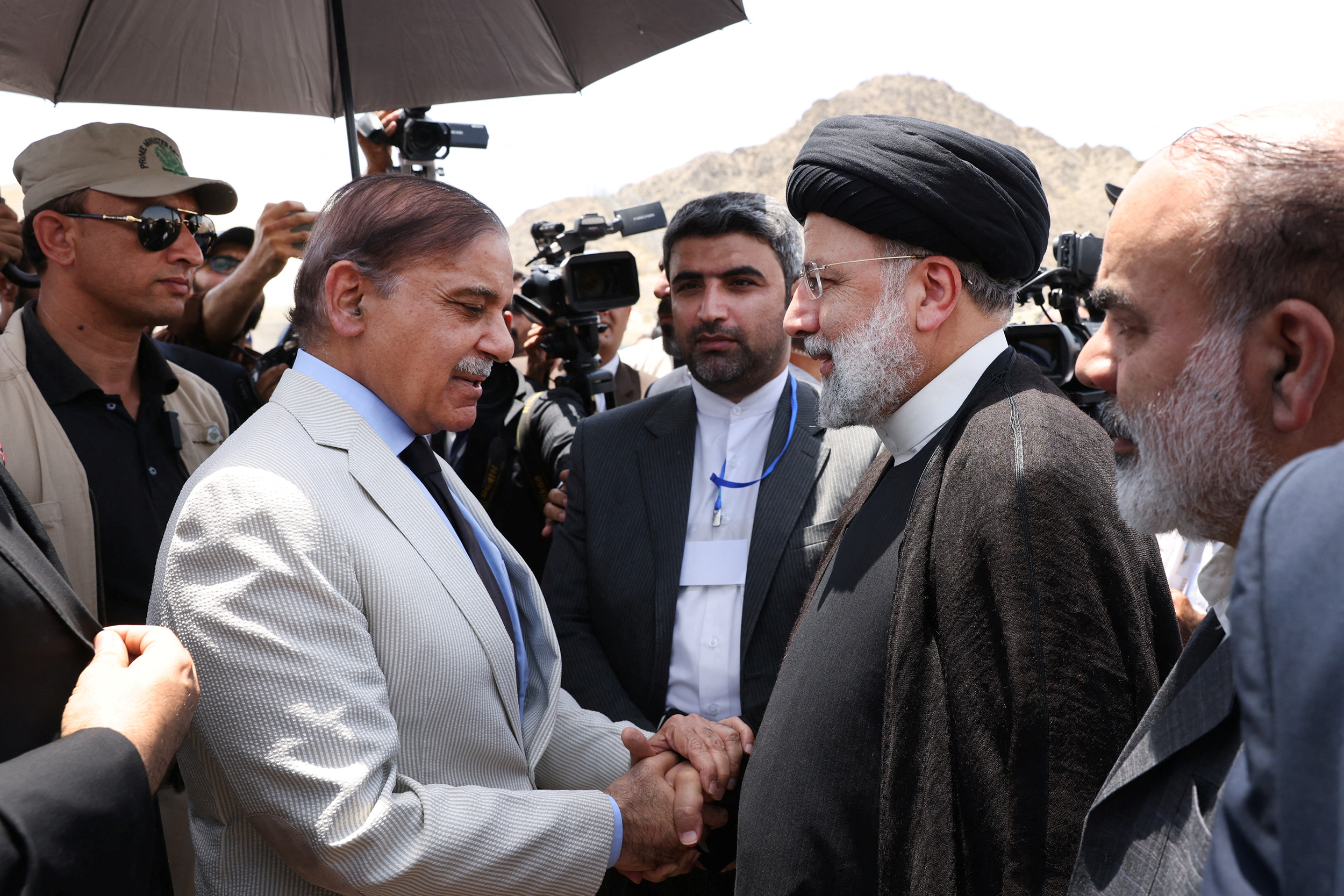 Iranian President Ebrahim Raisi meets Pakistan's then-Prime Minister Shehbaz Sharif in May 2023