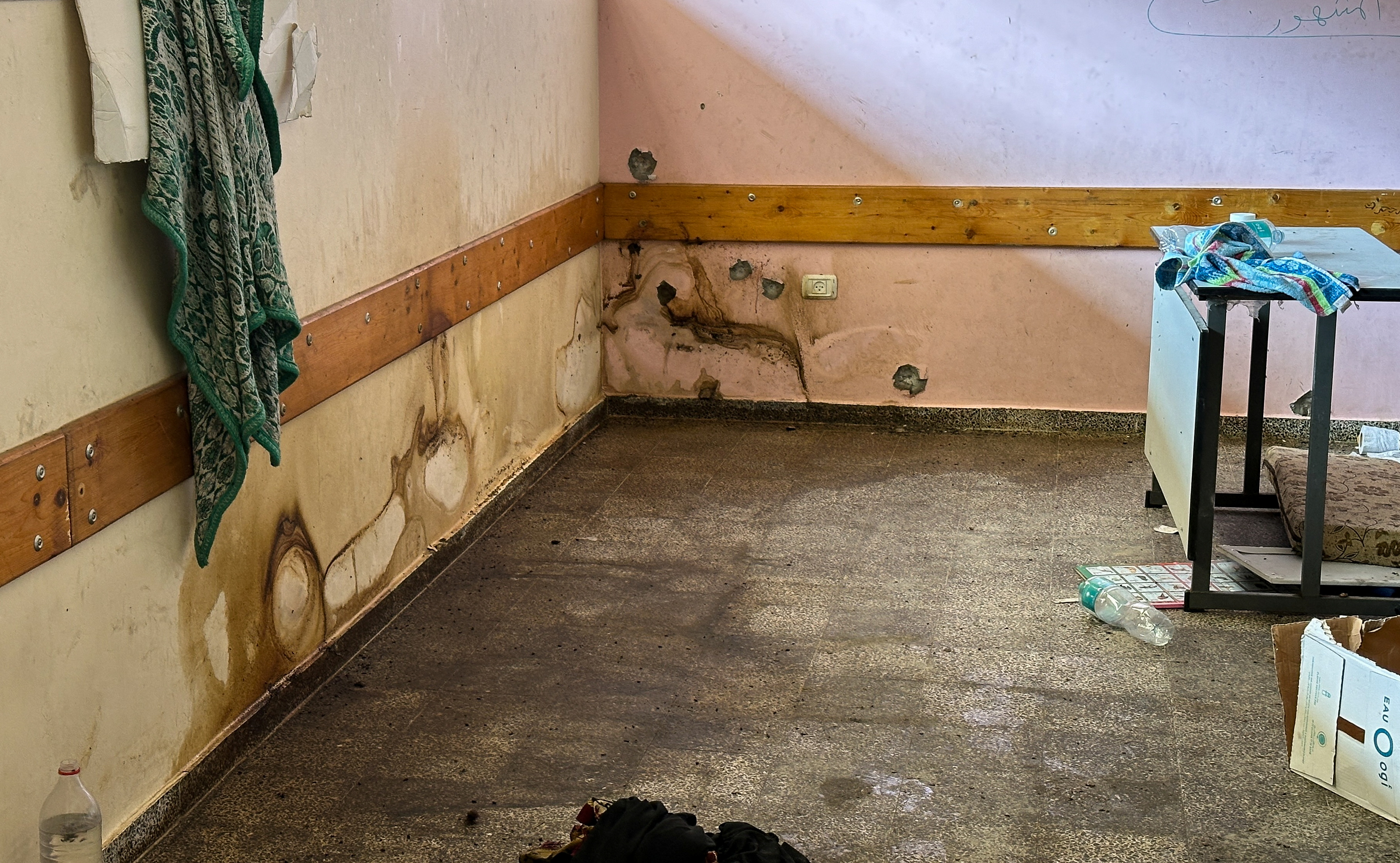 A view shows a damaged wall at Shadia Abu Ghazaleh school following an Israeli raid, amid the ongoing conflict between Israel and Hamas.