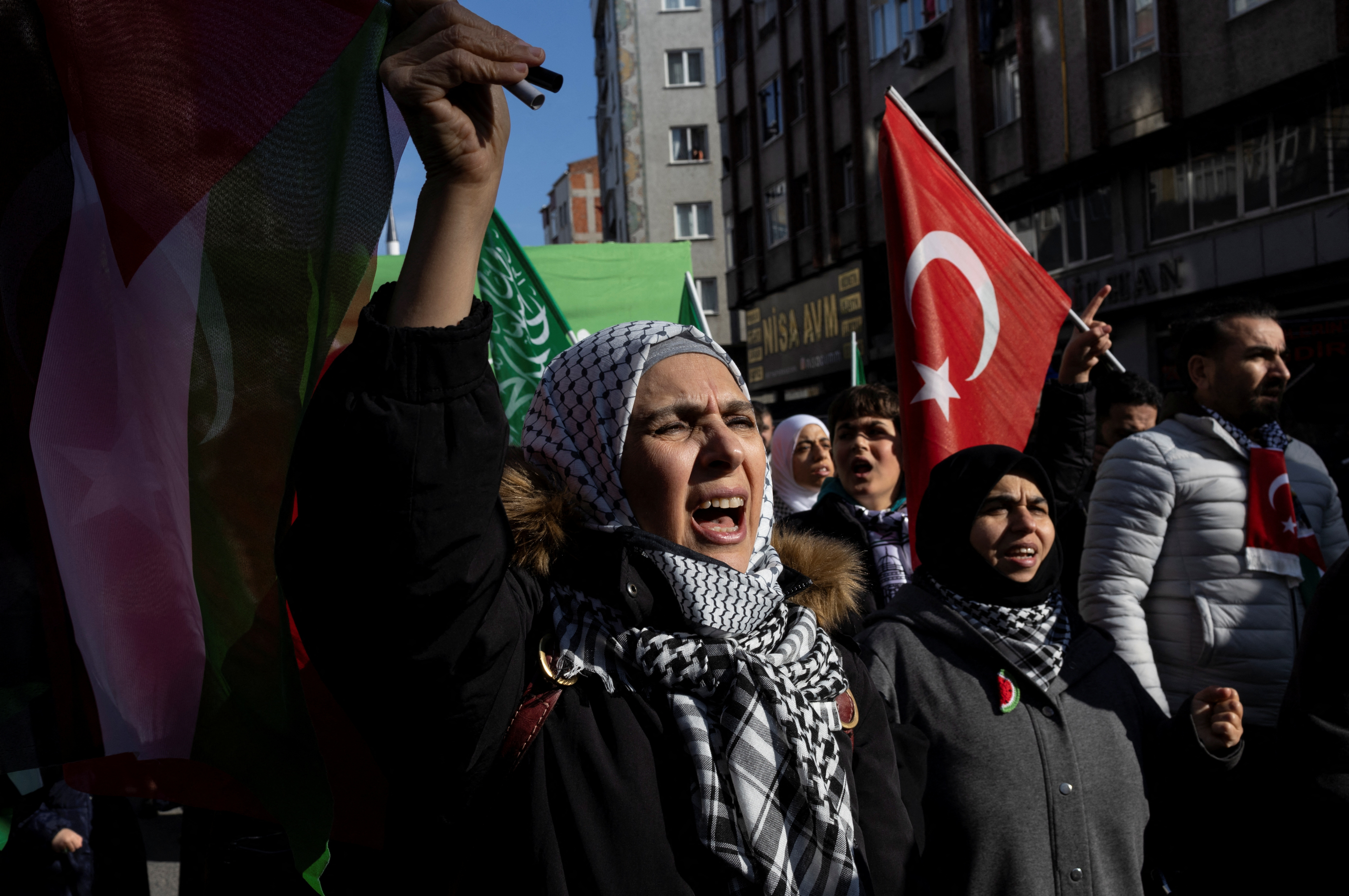 People take part in a demonstration in solidarity with Palestinians in the Gaza Strip, amid the ongoing conflict between Israel and the Palestinian Islamist group Hamas, in Istanbul, Turkey