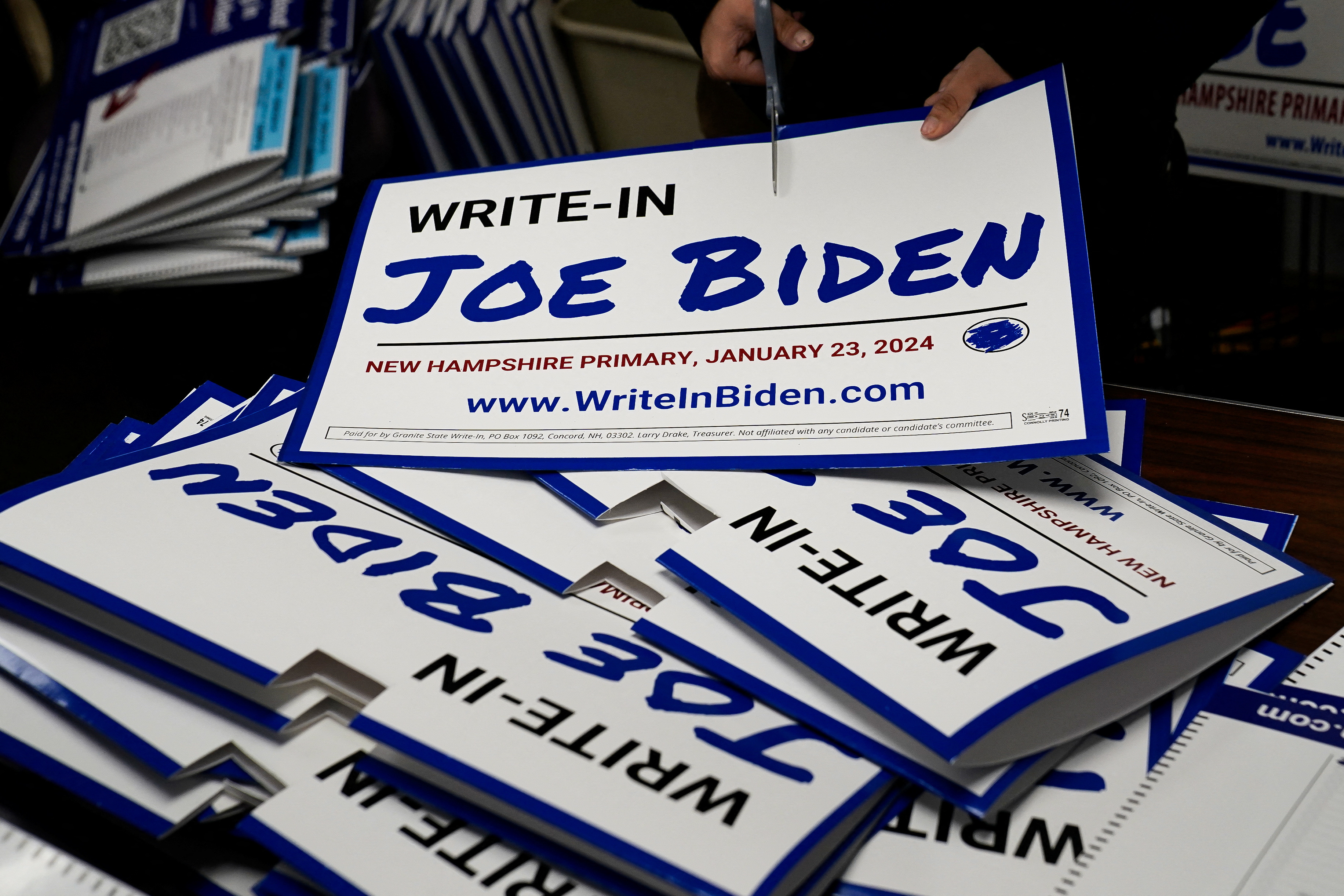 Signs promoting a write-in campaign to put Joe Biden on New Hampshire's primary ballot