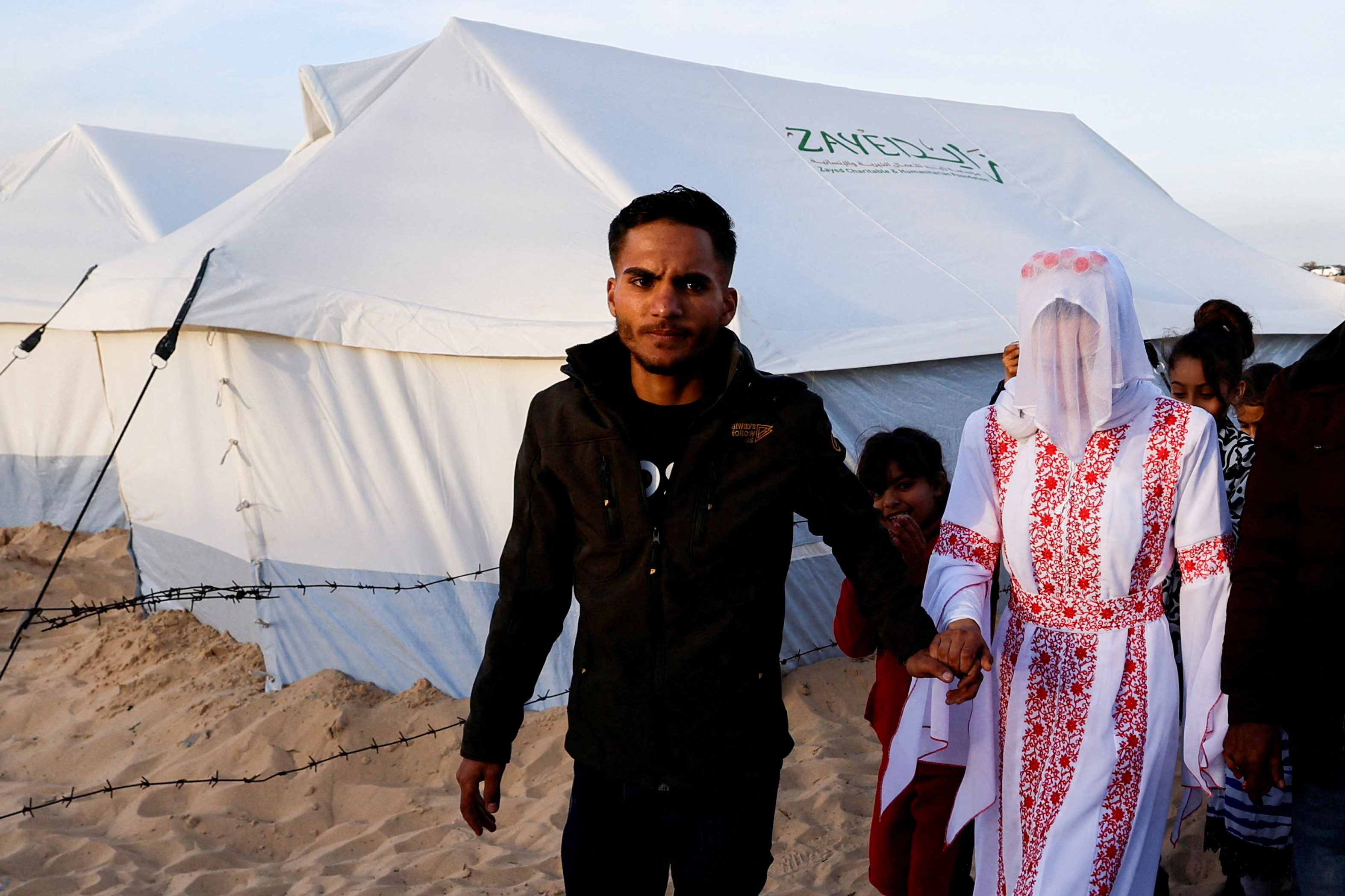 A Palestinian couple, Mohammed Al-Ghandour and his bride Shahad