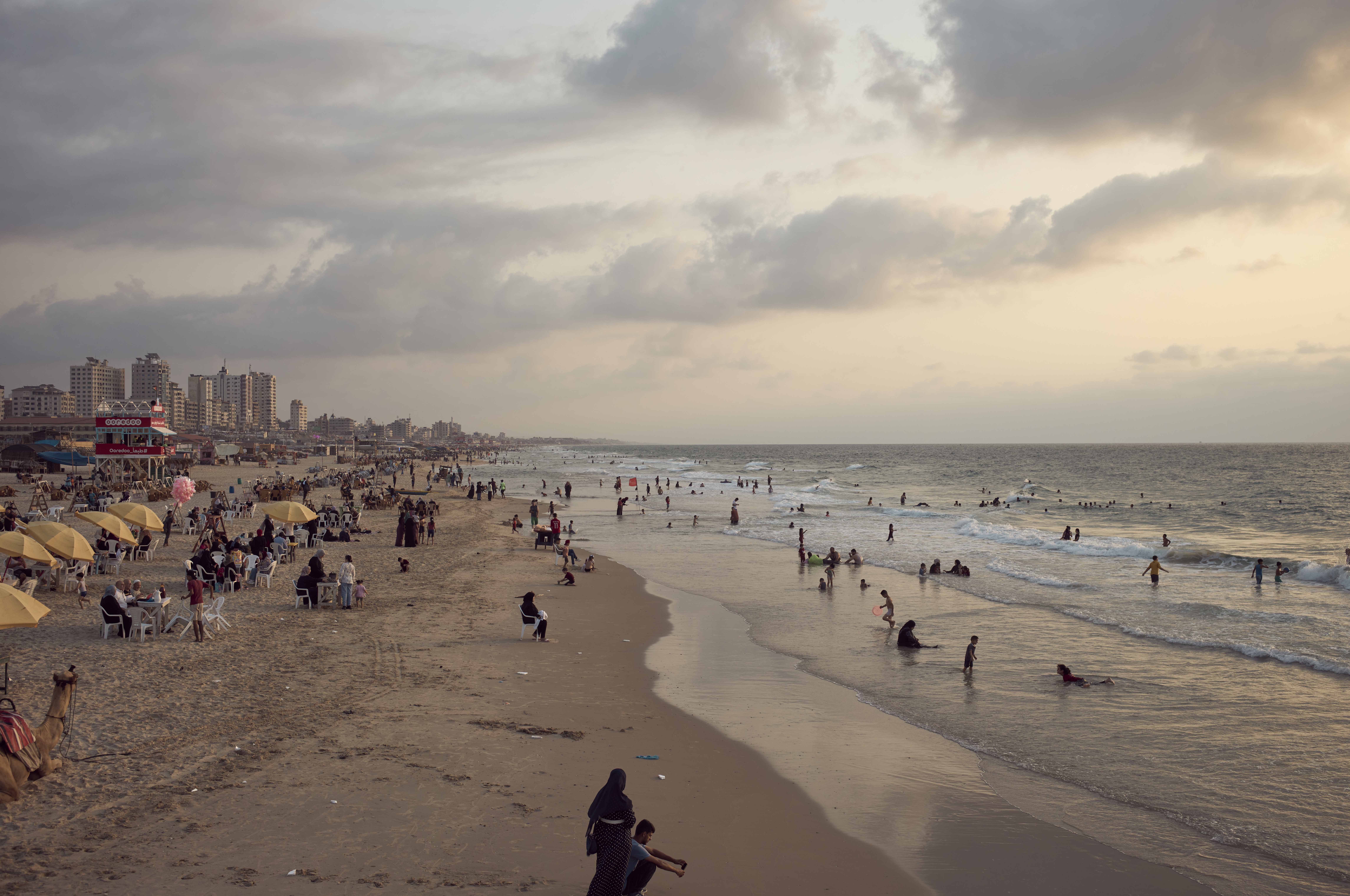 Gazans enjoy playing with their children at the beach, photographed in the autumn 2022. A distant memory for the 1.9 million displaced in Israels current war on the territory.