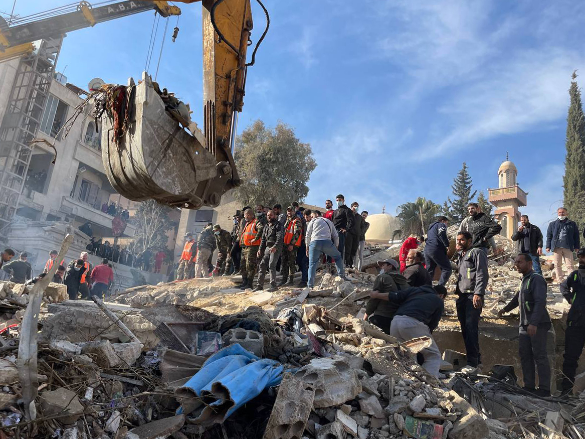 Heavy duty machine removes debris of a destroyed building after Israel's airstrike, which killed 4 commander of Islamic Revolutionary Guard Corps advisers, in Damascus, Syria on January 20