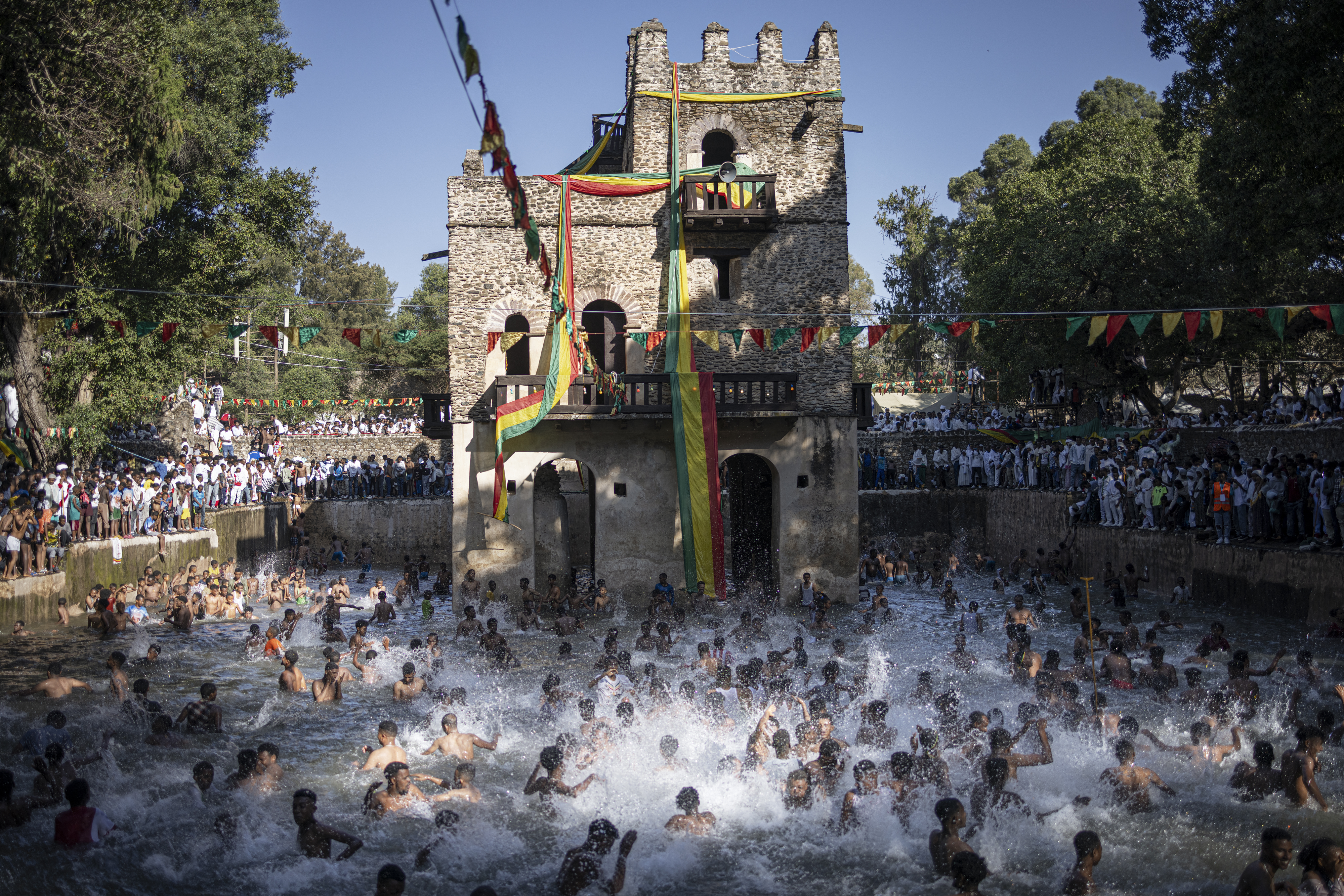 Ethiopian Orthodox worshippers bath into the Fasilides Bath during the celebration of Timkat, the Ethiopian Orthodox Epiphany, in Gondar on January 20