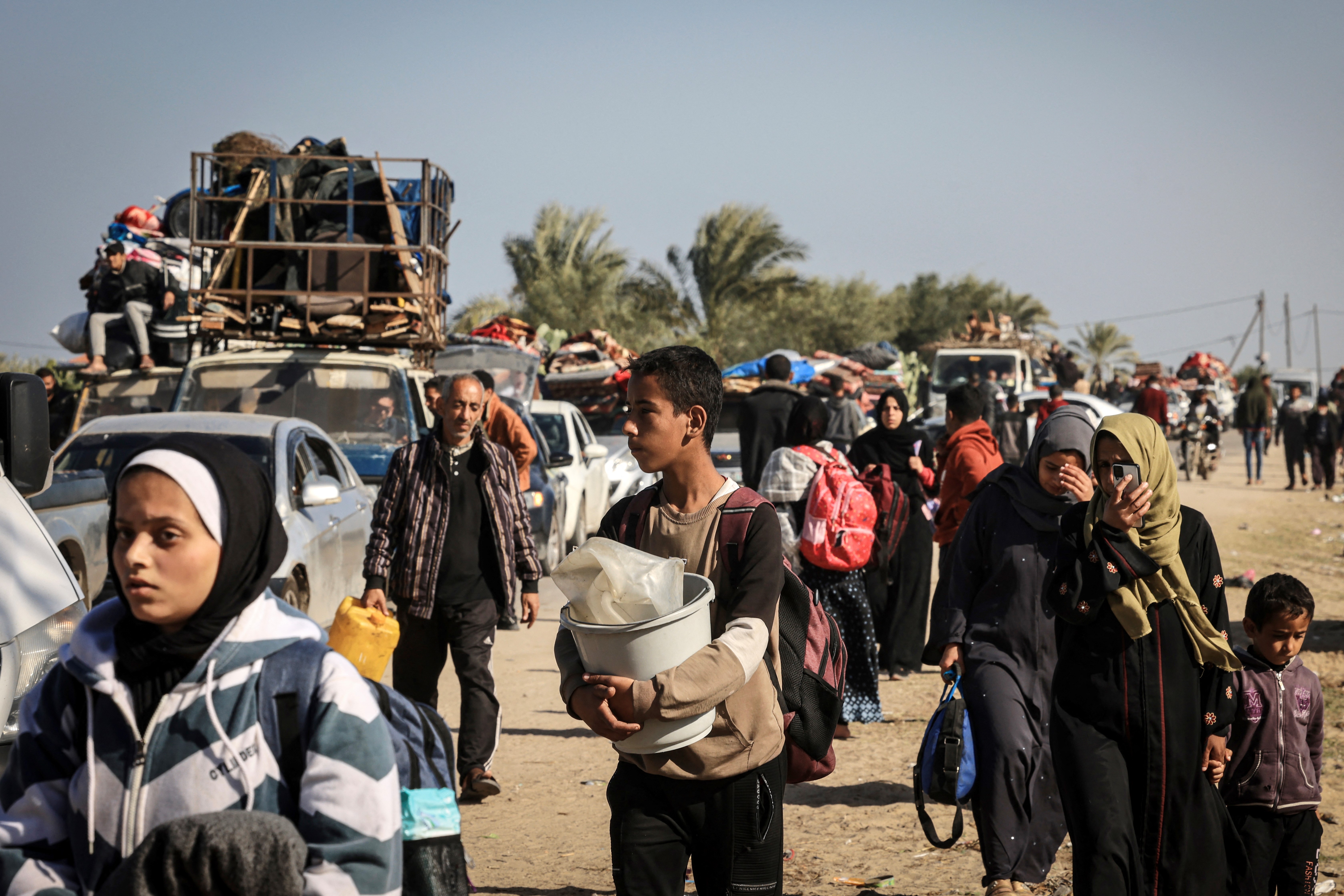Palestinian families fleeing the city on the coastal road leading to Rafah