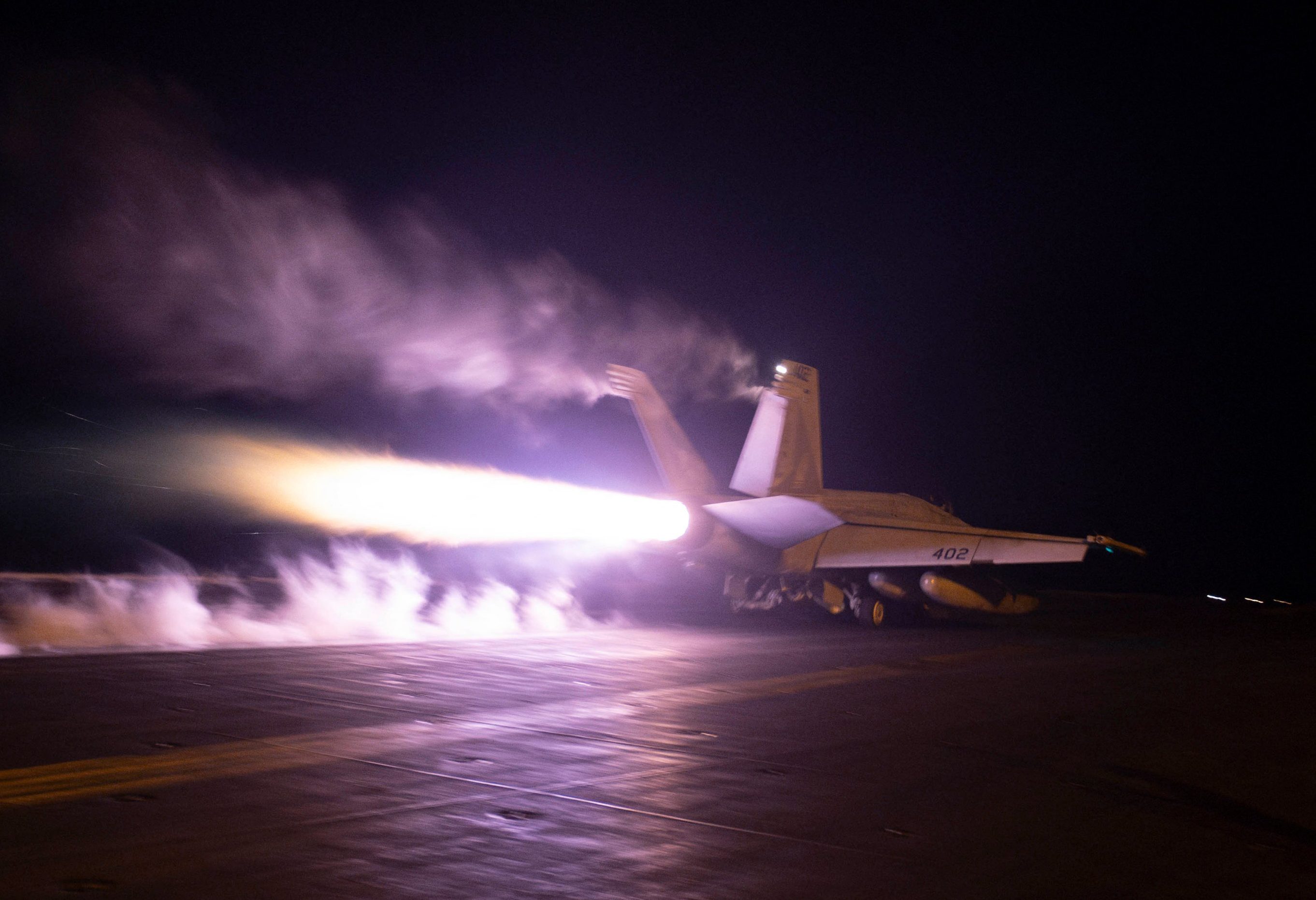 In this photo released by the US military's Central Command on January 22, 2024, US Central Command forces alongside UK Armed Forces, and with the support from Australia, Bahrain, Canada, and the Netherlands, conduct strikes on eight Houthi targets in Iranian-backed Houthi rebel-controlled areas of Yemen. - The United States and Britain launched new strikes on Yemen's Huthis January 22, saying their second round of joint military action against the Iran-backed rebels was in response to continued attacks on shipping. American and British forces carried out a first wave of strikes against the rebel group on January 11, and the United States launched further air raids against missiles that Washington said were ready to launch and posed a threat to both civilian and military vessels. (Photo by Handout / US Central Command (CENTCOM) / AFP) / RESTRICTED TO EDITORIAL USE - MANDATORY CREDIT "AFP PHOTO / HANDOUT / CENTCOM " - NO MARKETING - NO ADVERTISING CAMPAIGNS - DISTRIBUTED AS A SERVICE TO CLIENTS - RESTRICTED TO EDITORIAL USE - MANDATORY CREDIT "AFP PHOTO / HANDOUT / CENTCOM " - NO MARKETING - NO ADVERTISING CAMPAIGNS - DISTRIBUTED AS A SERVICE TO CLIENTS /