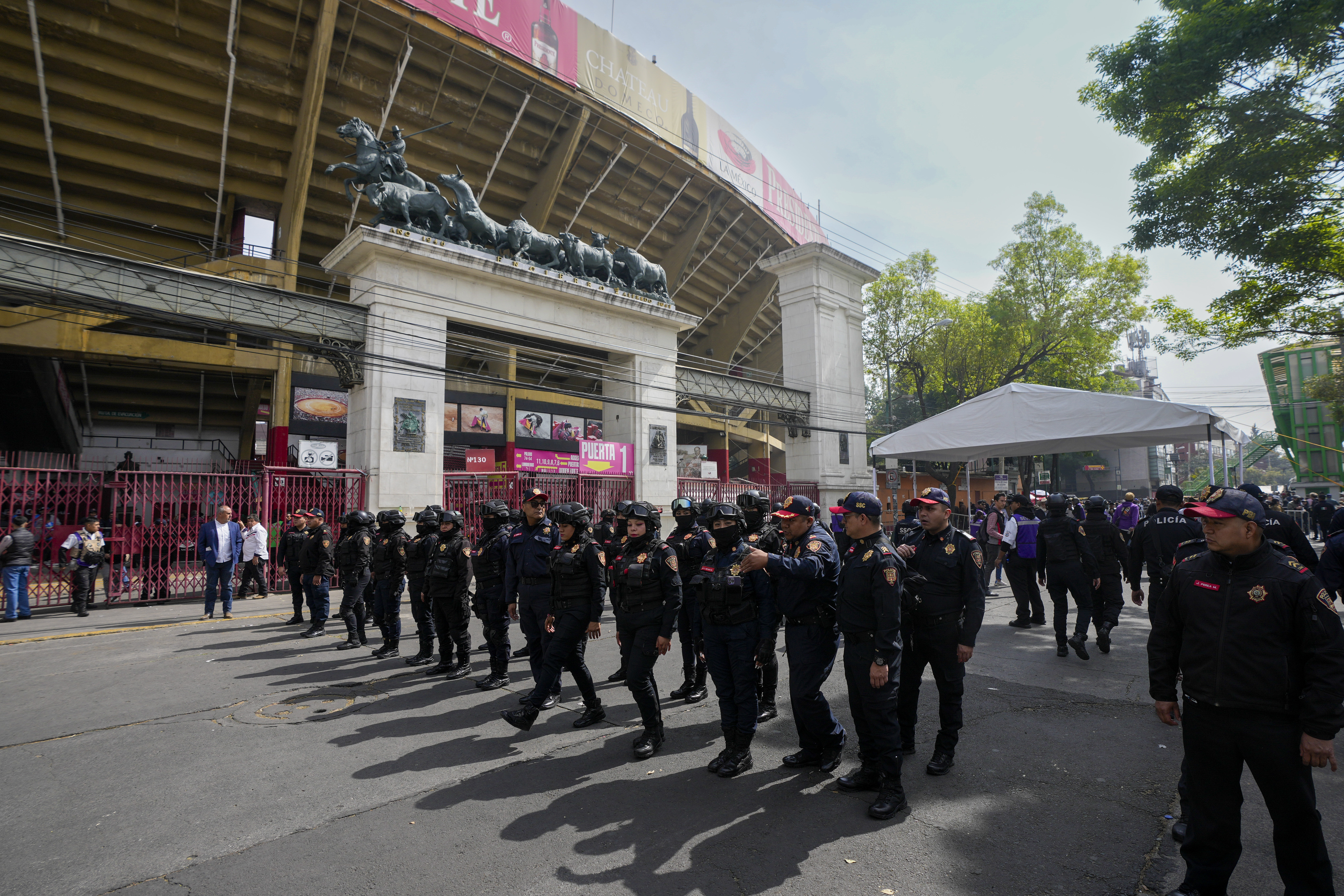 Police agents stand guard at the Plaza Mexico