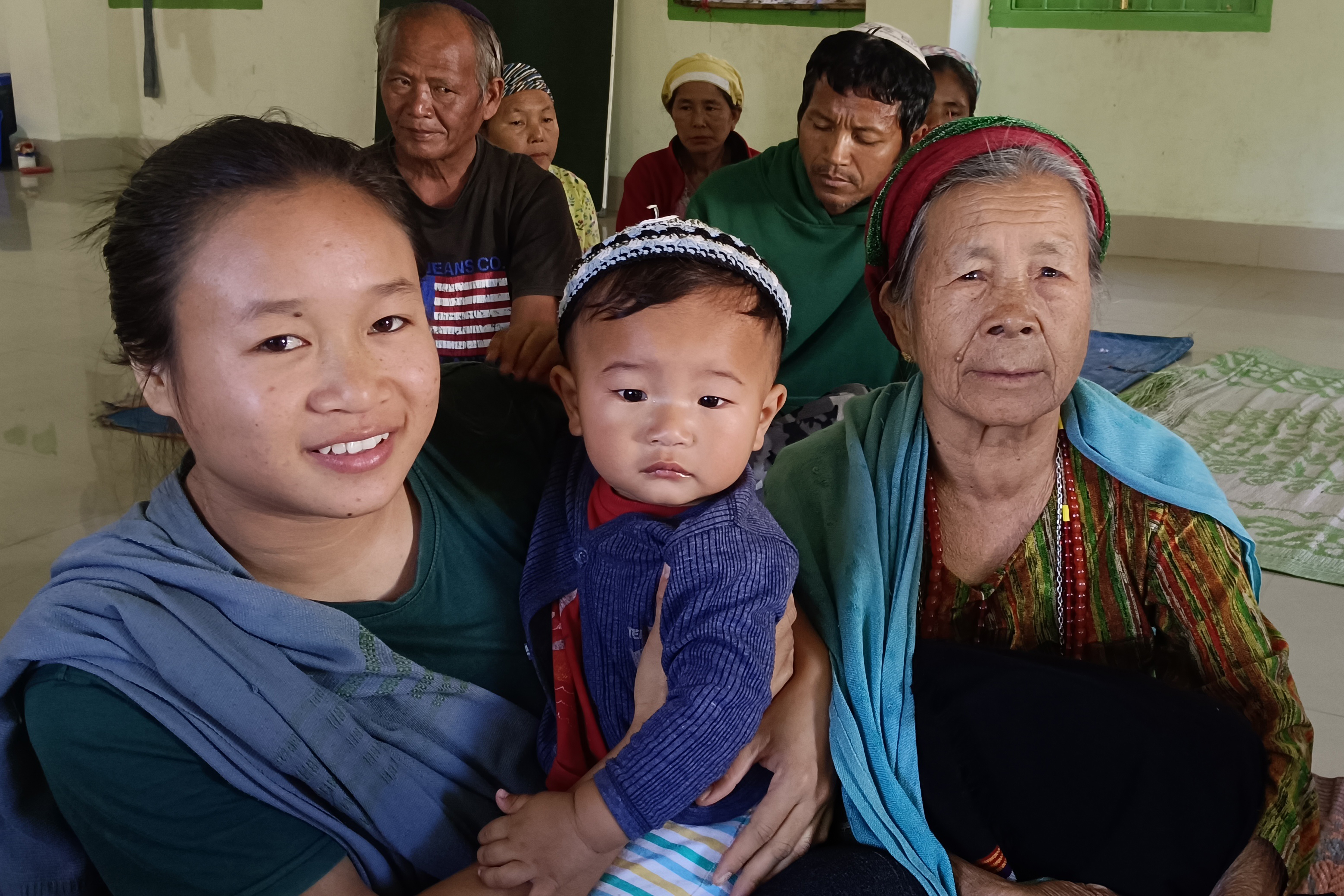 Ngaikhochin Kipgen with her teenage granddaughter Naokim and one-year-old grandson Shaior Kipgen