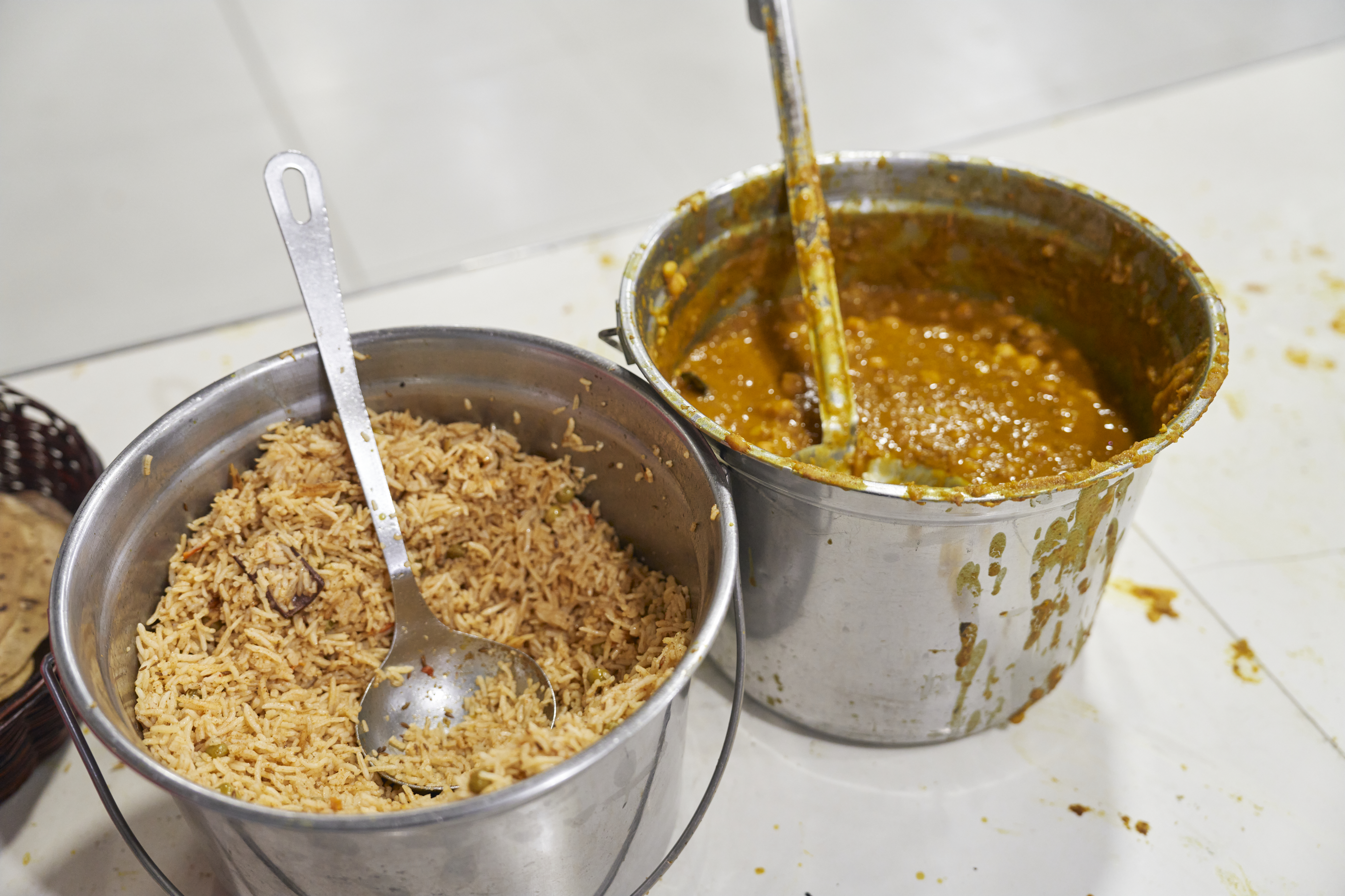 Pails of food for devotees at the main dining hall of the Khalsa Diwan Sikh Temple Manila 