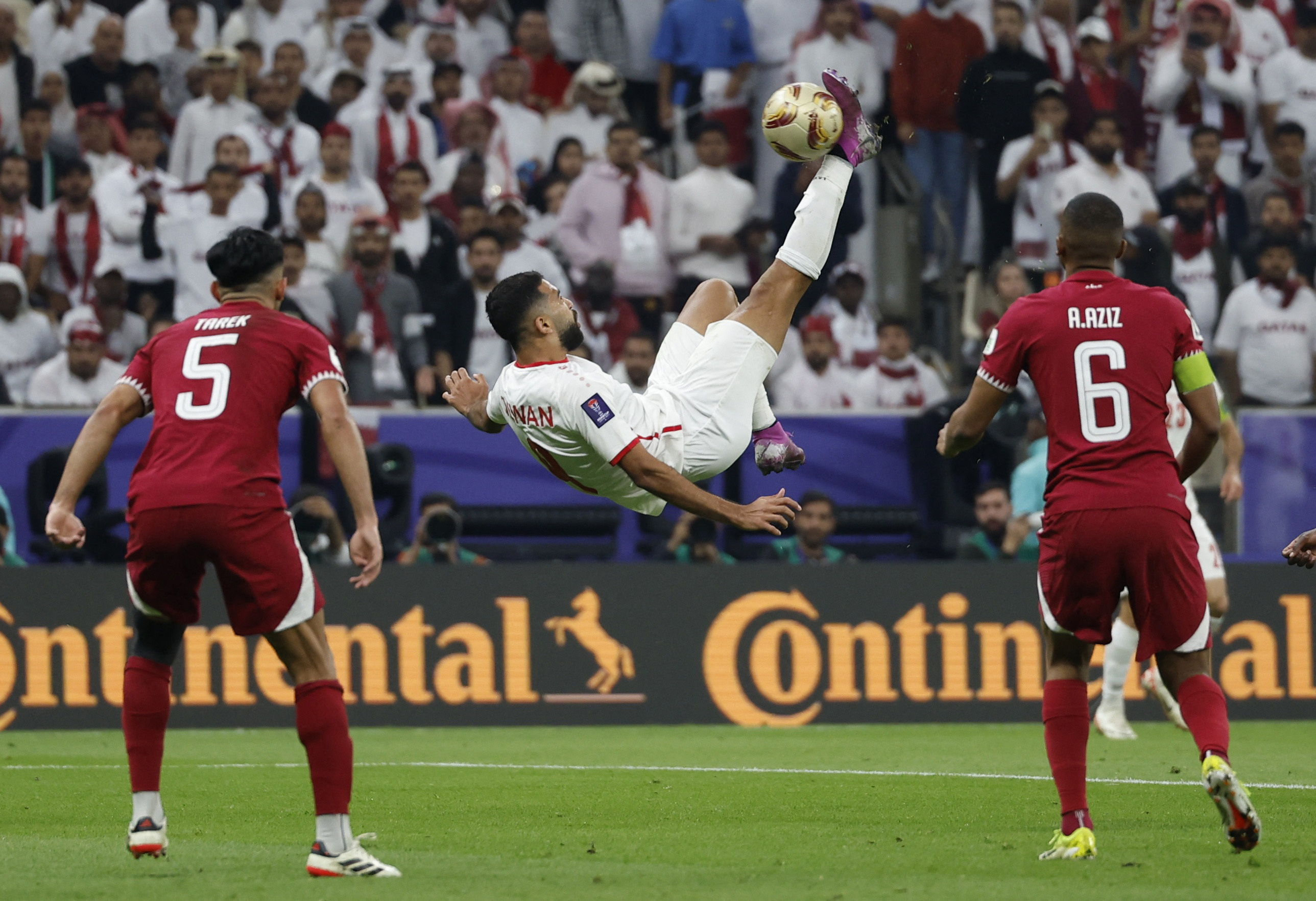Jordan's Ali Olwan shoots at goal with an overhead kick