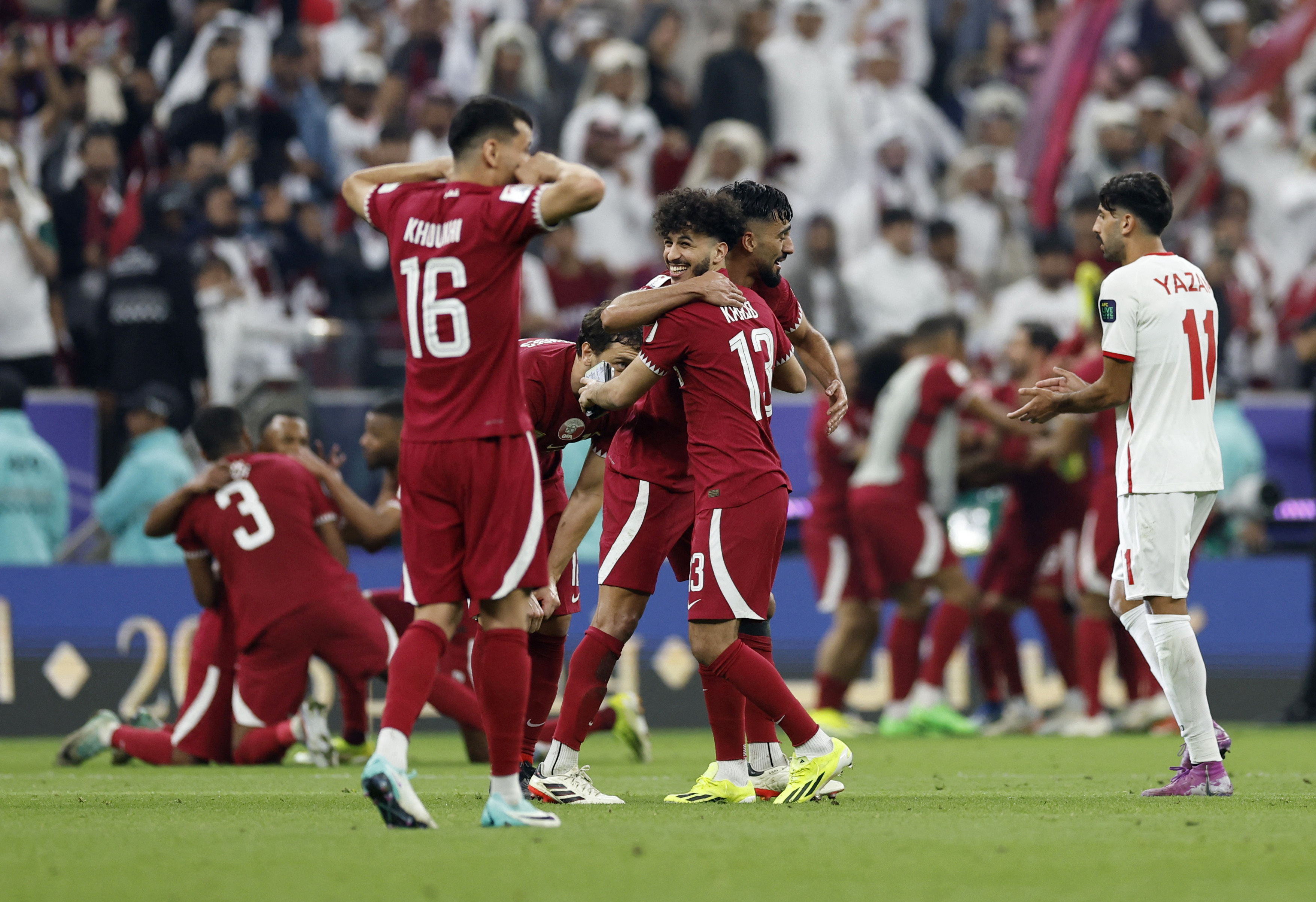 Qatar's Khalid Muneer celebrates after winning the AFC Asian Cup