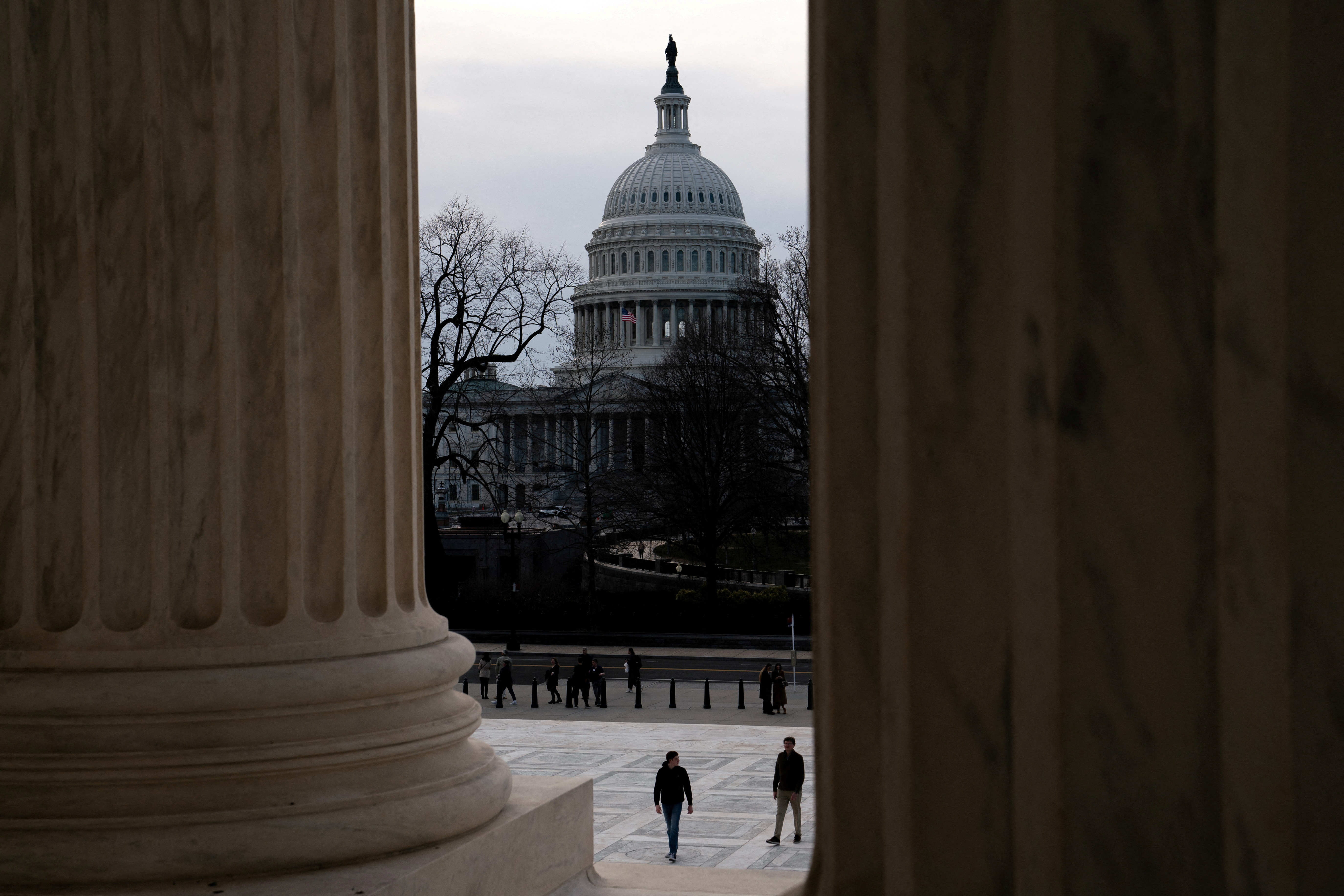 Tourists walk near the US Capitol