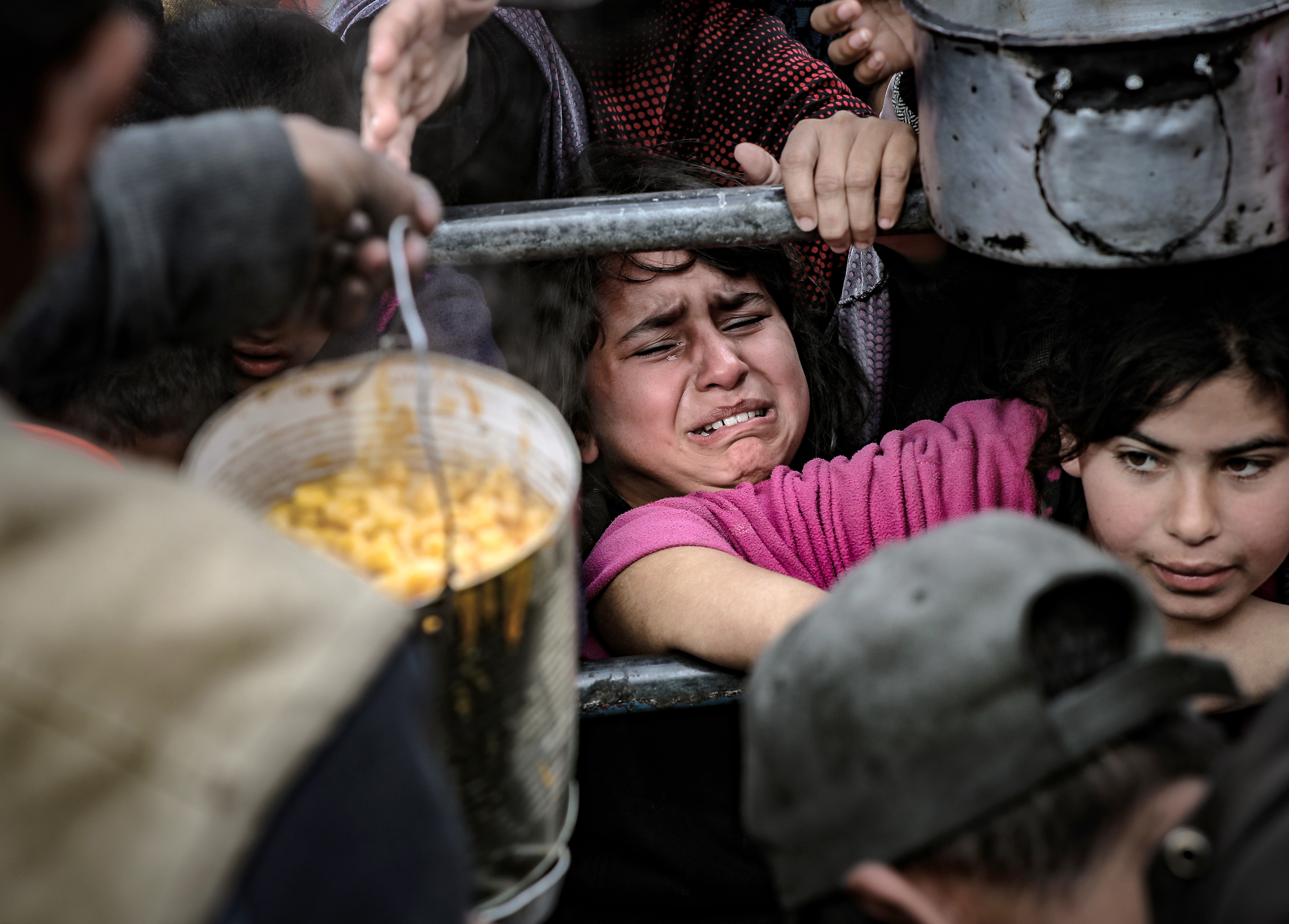 people struggling to get some food