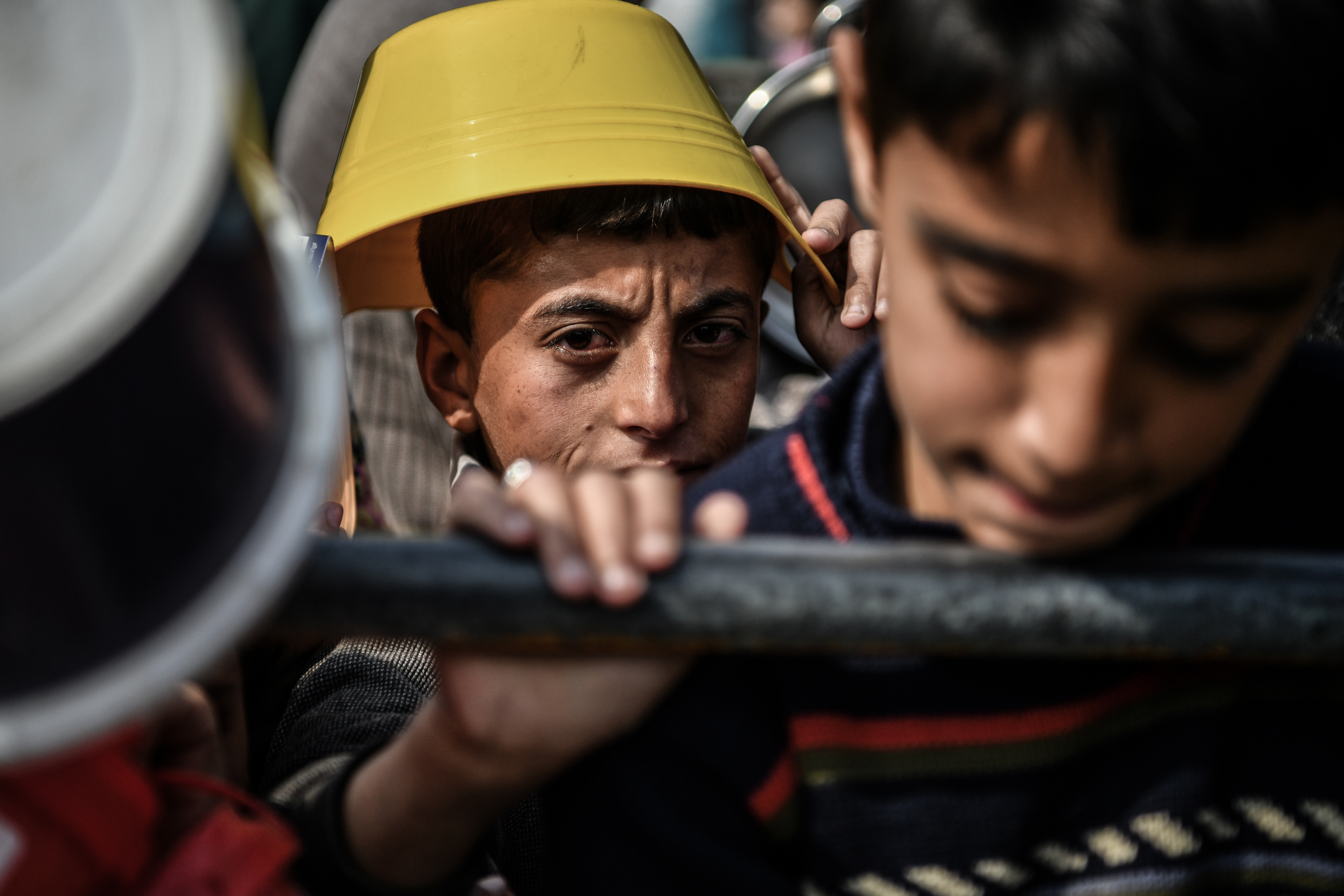 11-year-old Muhammed Zurub waits in distribution queues f
