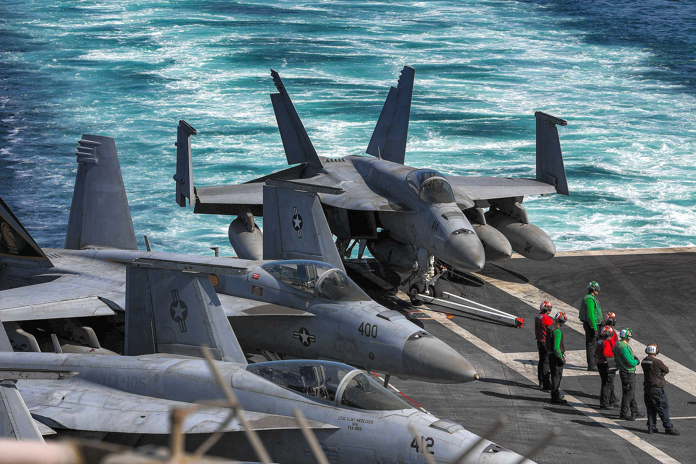 In this photo obtained from the US Department of Defense, US Navy F/A-18 Hornet multirole combat aircraft are pictured on the deck of the aircraft carrier USS Dwight D. Eisenhower (CVN 69) (IKE) transits the Strait of Hormuz on November 26, 2023. - The United States said on November 29 that an Iranian drone flew dangerously close to the USS Dwight D. Eisenhower aircraft carrier the day before. The Eisenhower is the centerpiece of one of two carrier strike groups deployed as part of US efforts to deter Iran and its proxy forces in the Middle East from escalating the Israel-Hamas war into a broader regional conflict. (Photo by Kade Bise / US Department of Defense / AFP) / RESTRICTED TO EDITORIAL USE - MANDATORY CREDIT "AFP PHOTO / US DEPARTMENT OF DEFENSE/US NAVY" - NO MARKETING NO ADVERTISING CAMPAIGNS - DISTRIBUTED AS A SERVICE TO CLIENTS - RESTRICTED TO EDITORIAL USE - MANDATORY CREDIT "AFP PHOTO / US Department of Defense/US Navy" - NO MARKETING NO ADVERTISING CAMPAIGNS - DISTRIBUTED AS A SERVICE TO CLIENTS /