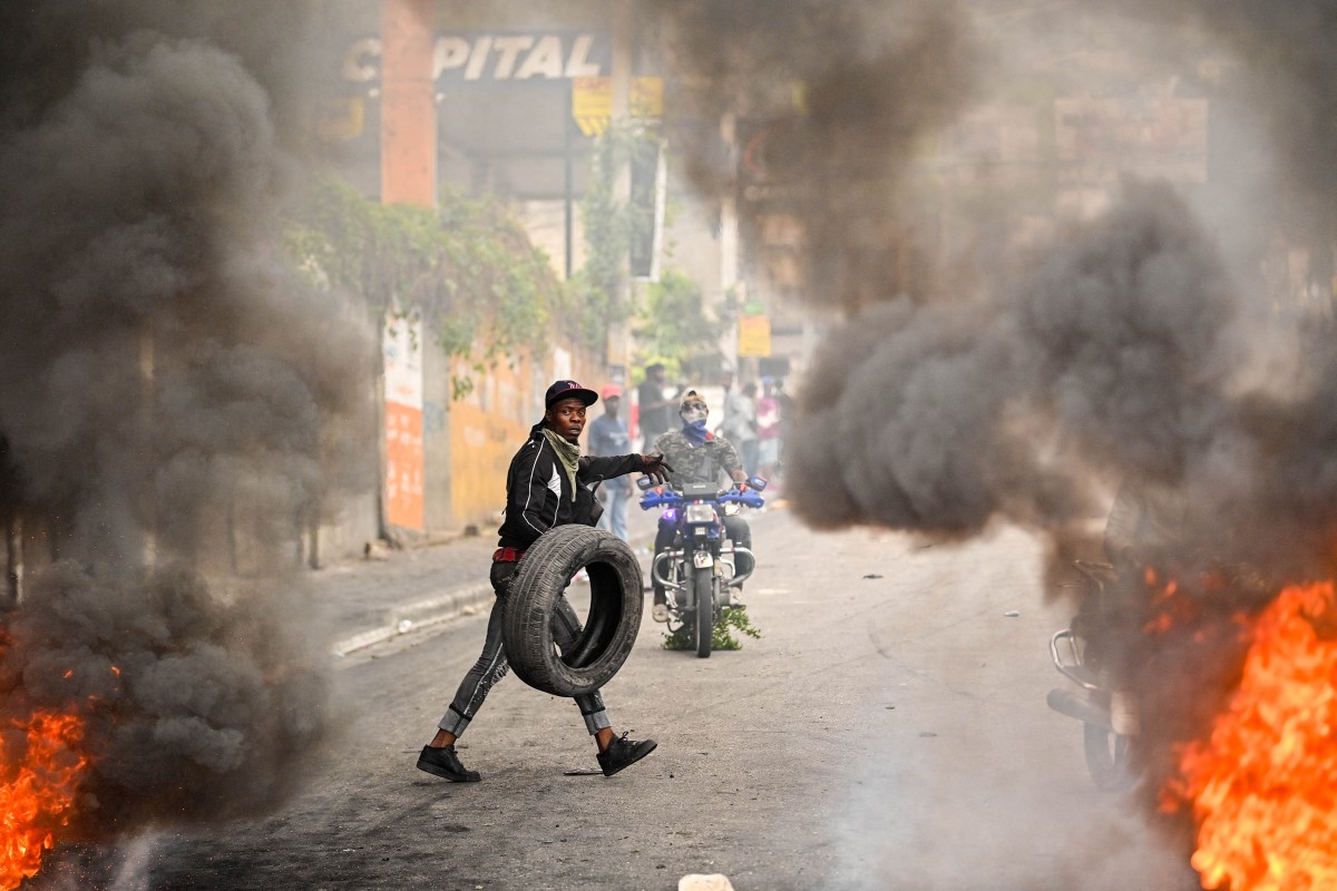 A protester burns tires