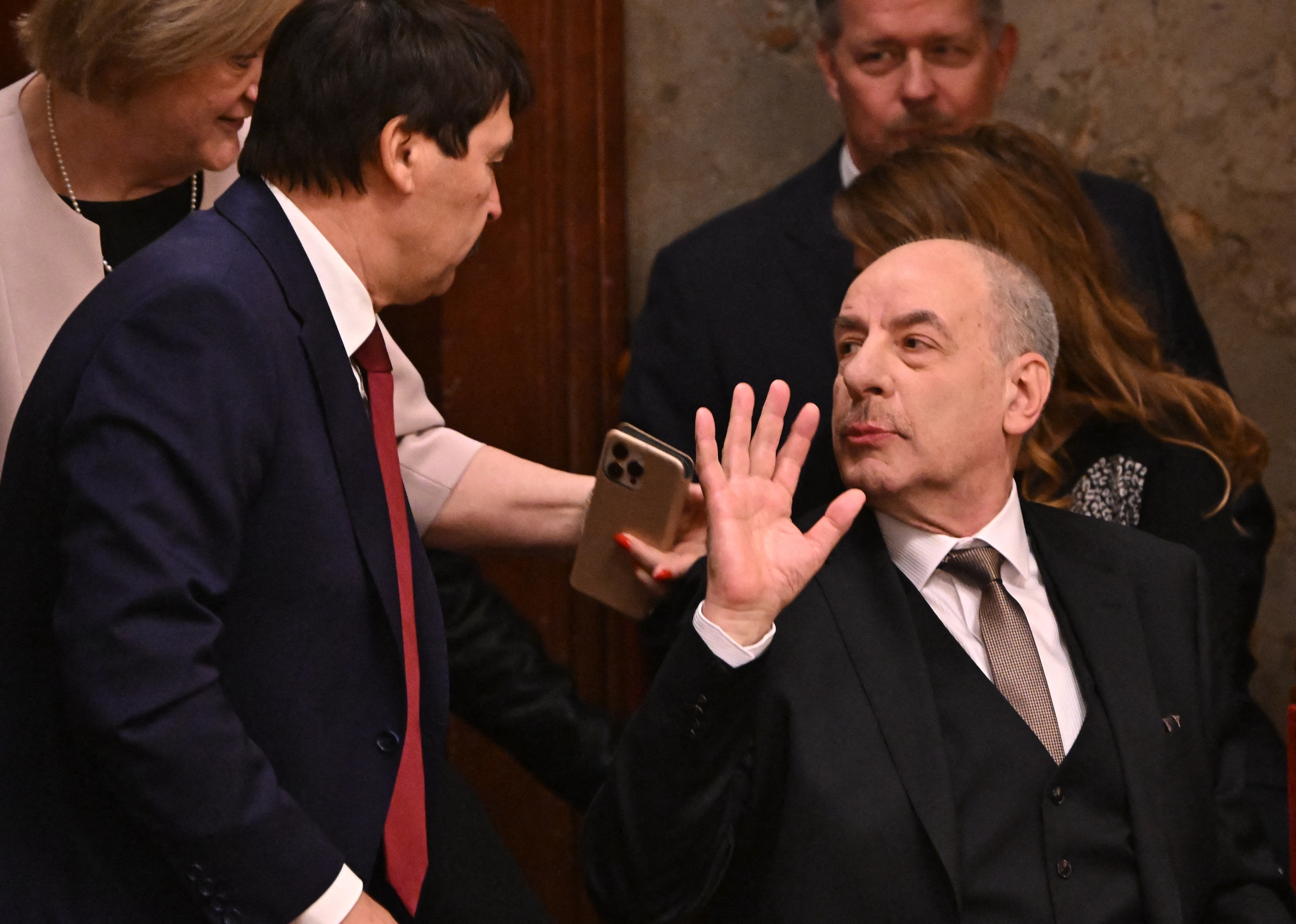 The new presidential candidate of Hungary, former chairman of the Constitutional Court Tamas Sulyok (R) is seen with former president Janos Ader (L) in the main hall of the parliament building in Budapest on February 26, 2024. (Photo by ATTILA KISBENEDEK / AFP)