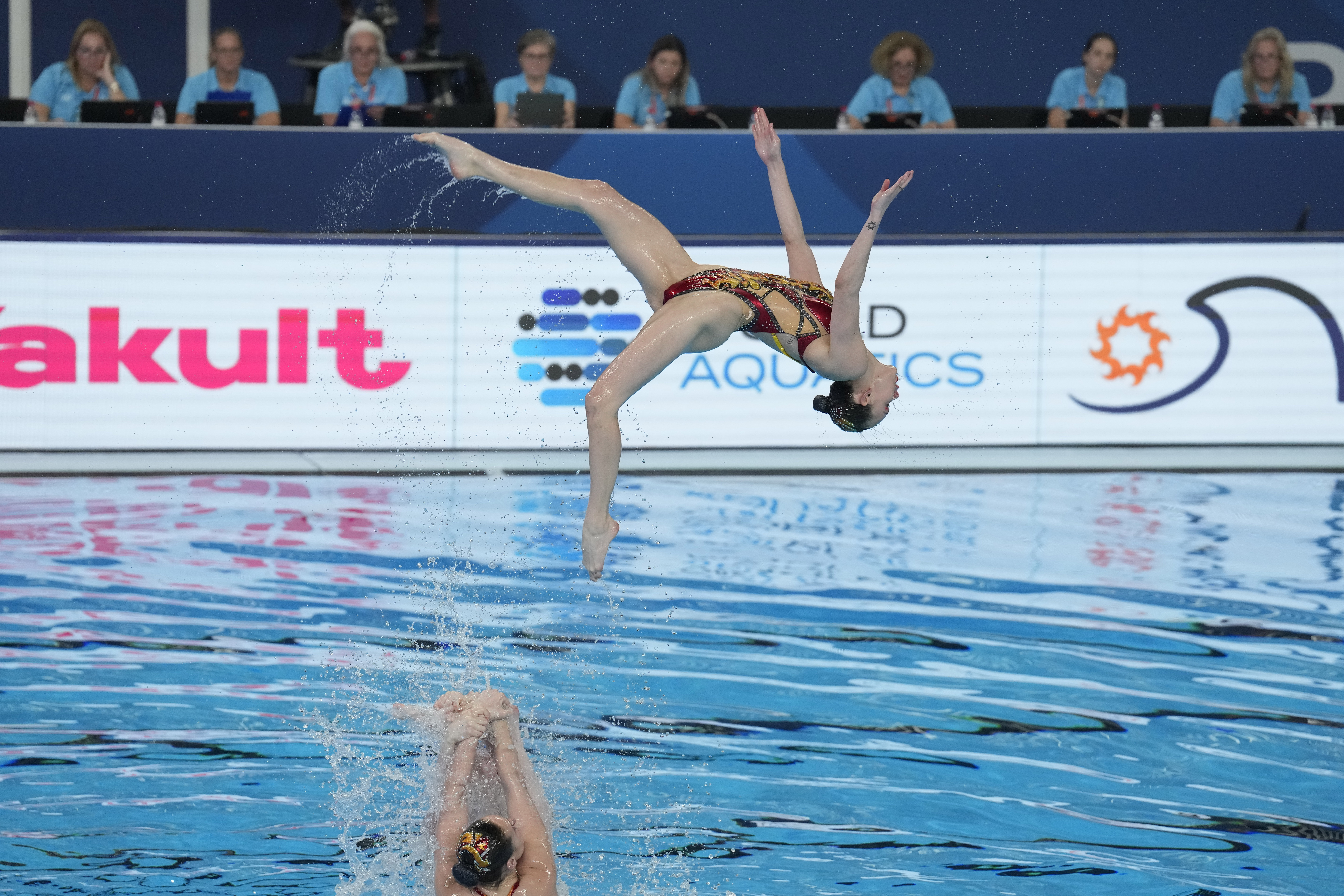 Canada team compete in the mixed team acrobatic final of artistic swimming at the World Aquatics Championships in Doha, Qatar, Sunday, Feb. 4