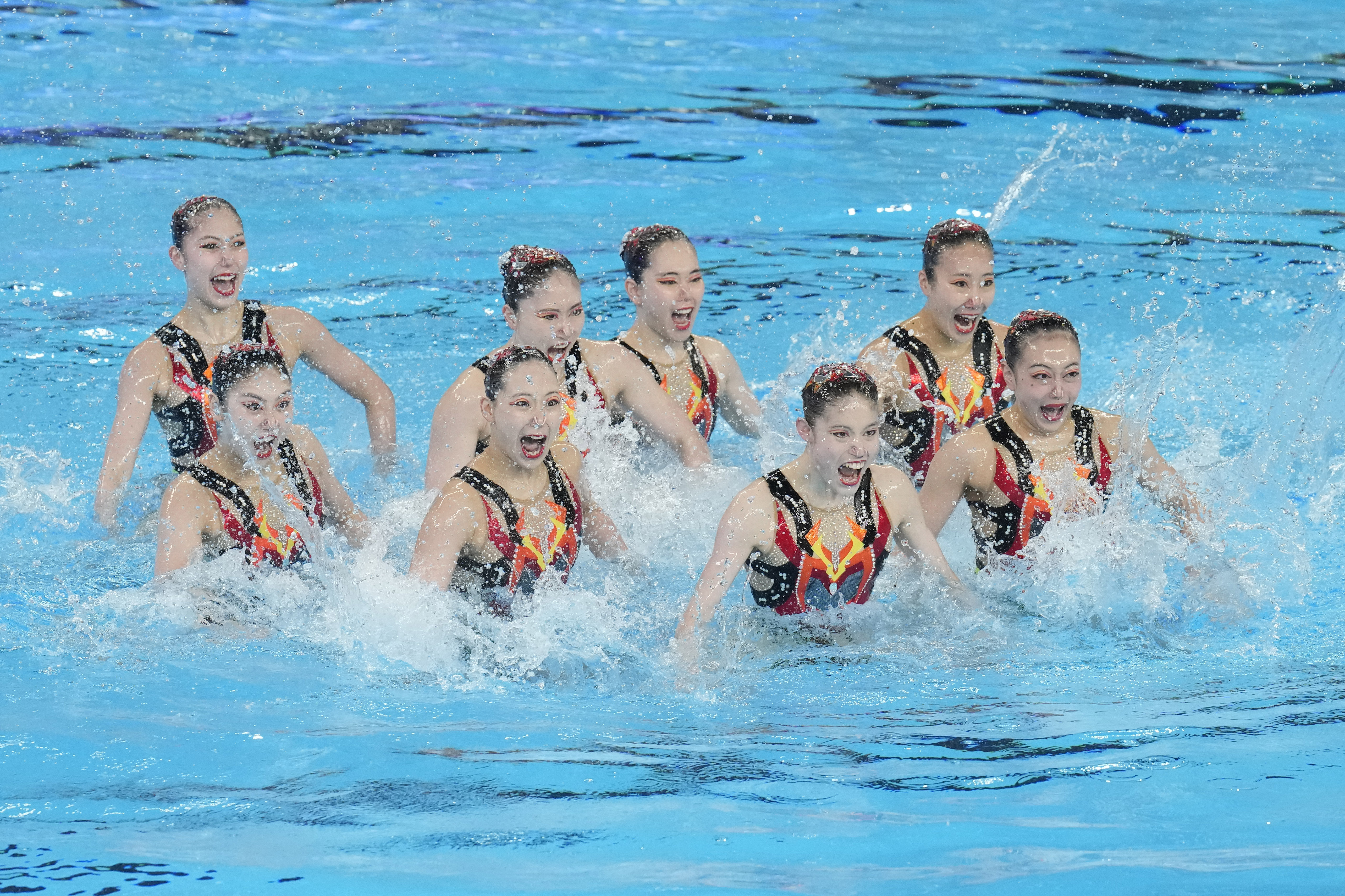 Japan team compete in the mixed team acrobatic final of artistic swimming at the World Aquatics Championships in Doha, Qatar, Sunday, Feb. 4