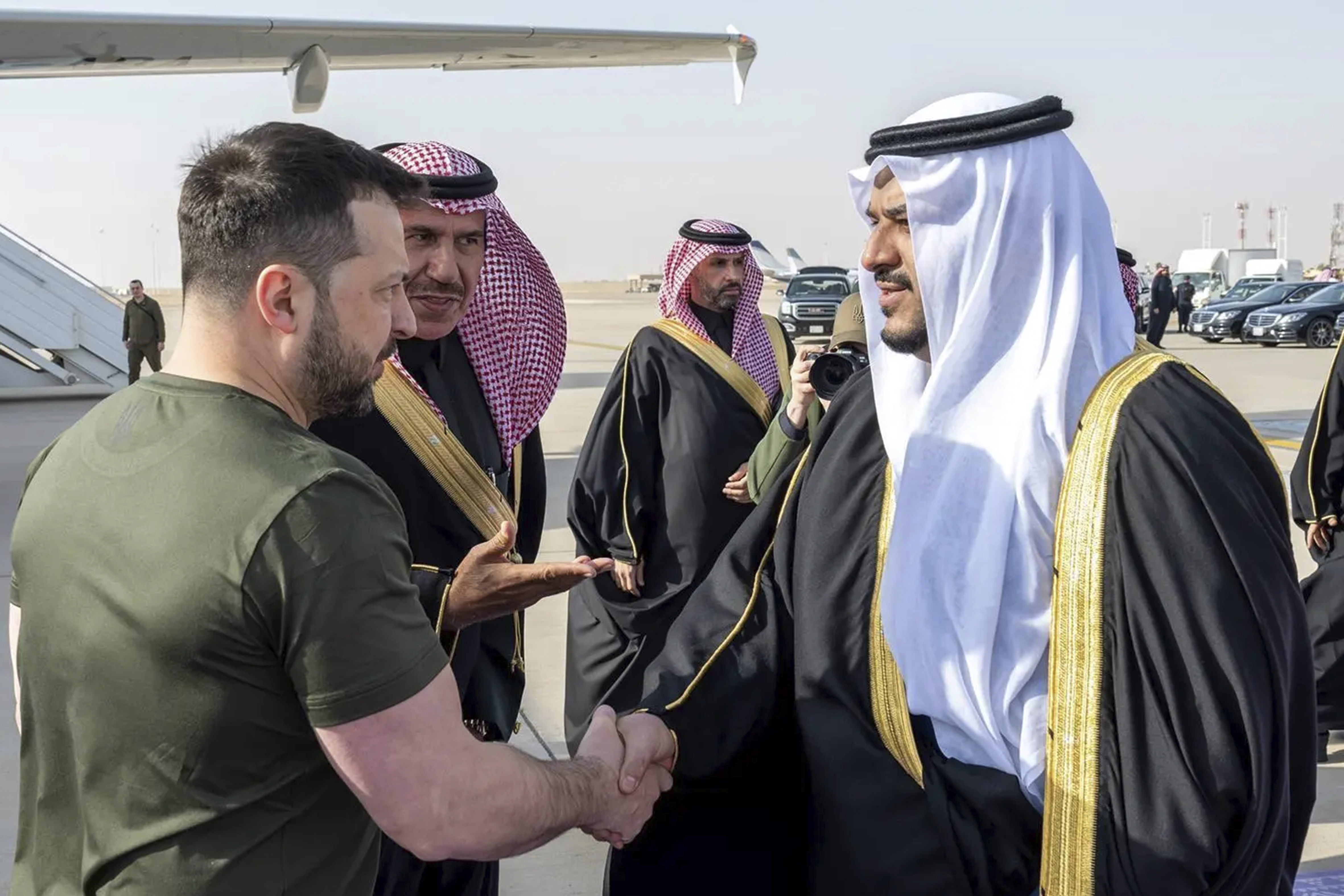 In this photo provided by Saudi Press Agency, SPA, Ukrainian President Volodymyr Zelenskyy is greeted by Prince Mohammed bin Abdulrahman bin Abdulaziz, Deputy Governor of Riyadh, upon his arrival at King Khalid International Airport, in Riyadh, Saudi Arabia, Tuesday, Feb. 27, 2024. (Saudi Press Agency via AP)