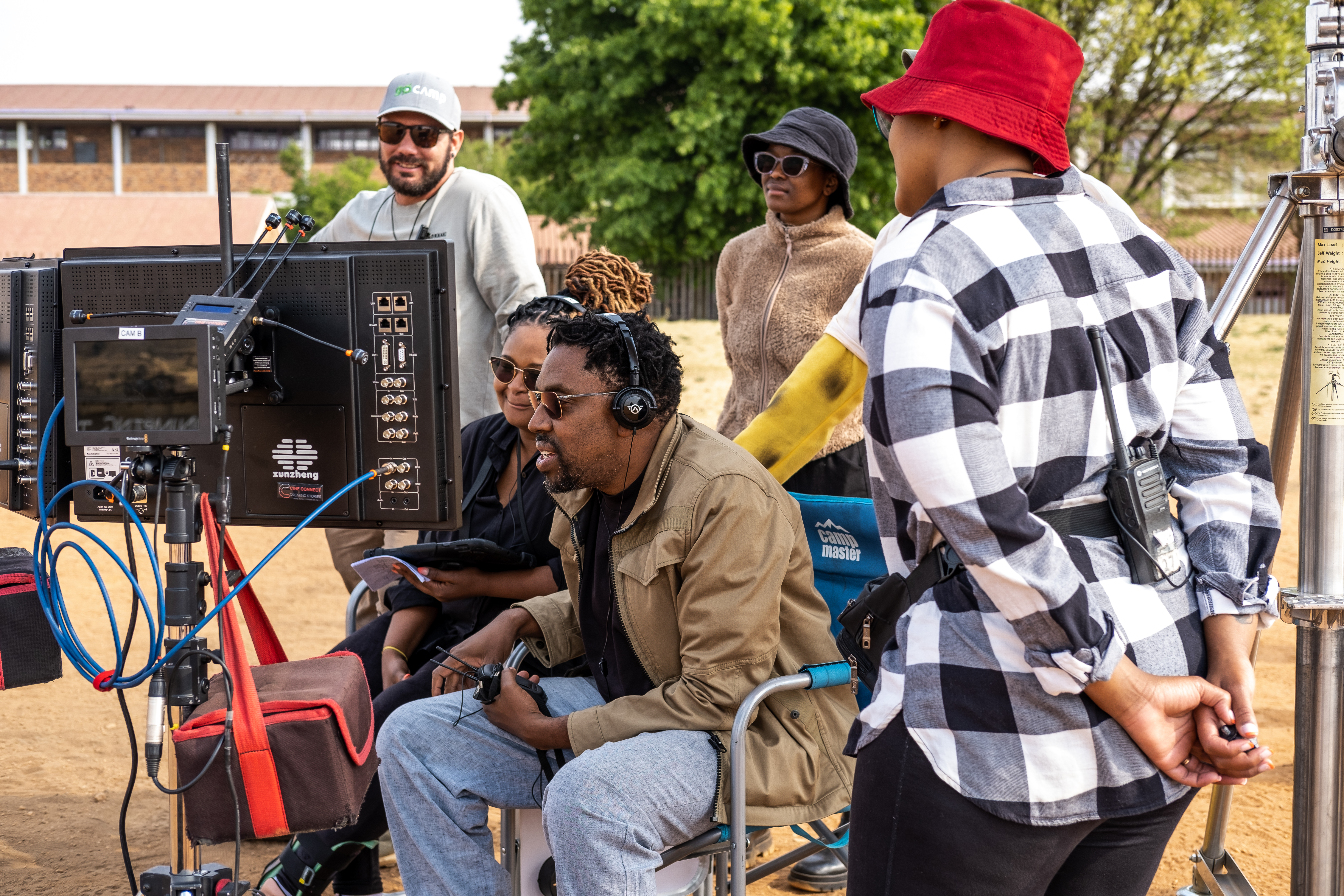 Kagiso Lediga and crew members on the set of his latest project for Netflix/Amazon Freevee [Courtesy: Diprente]