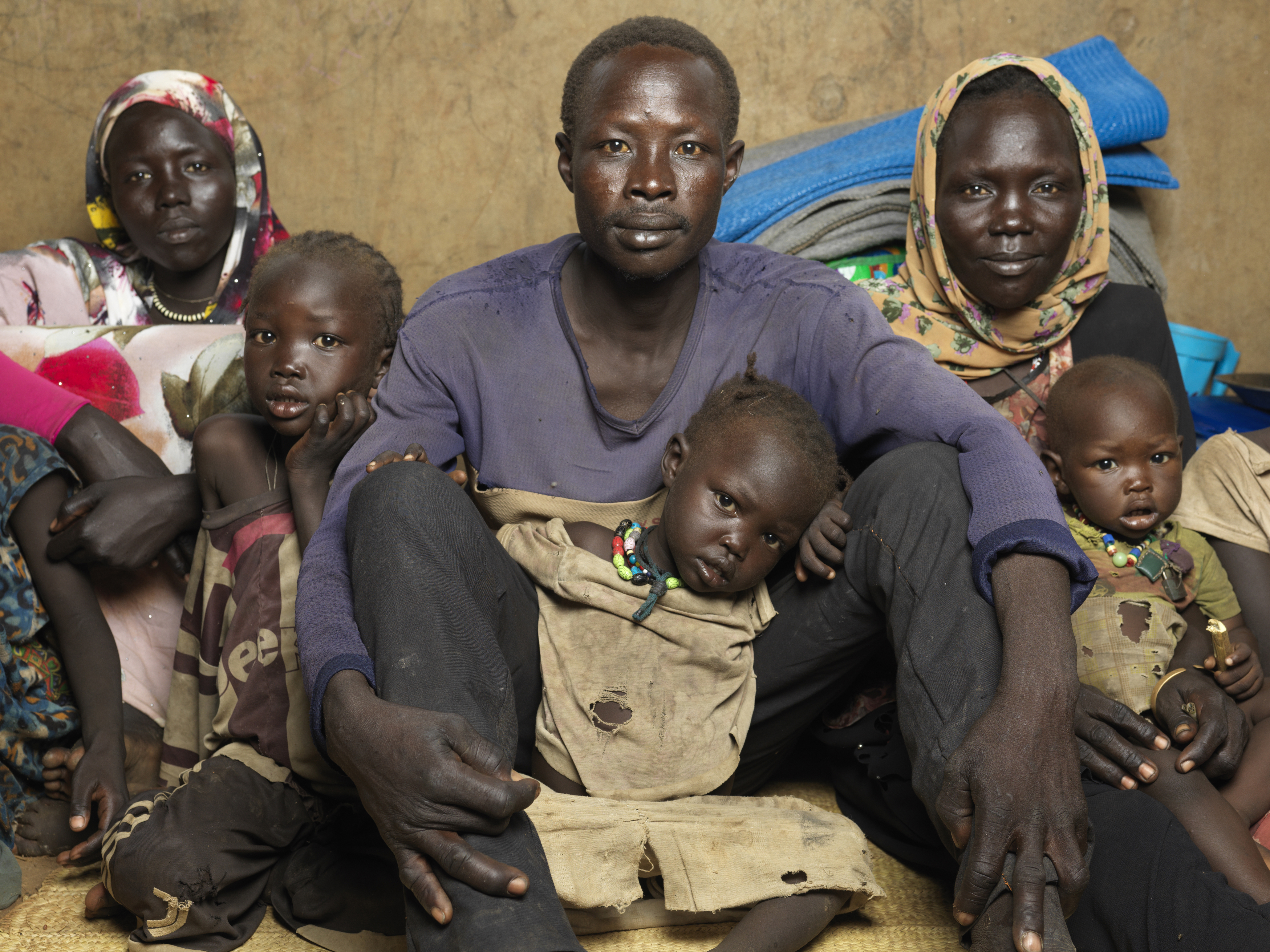 New arrivals Abdalla Muhammad, Fatima Salim and Kazima Salim with their children pictured at Doro Camp reception centre in Maban.